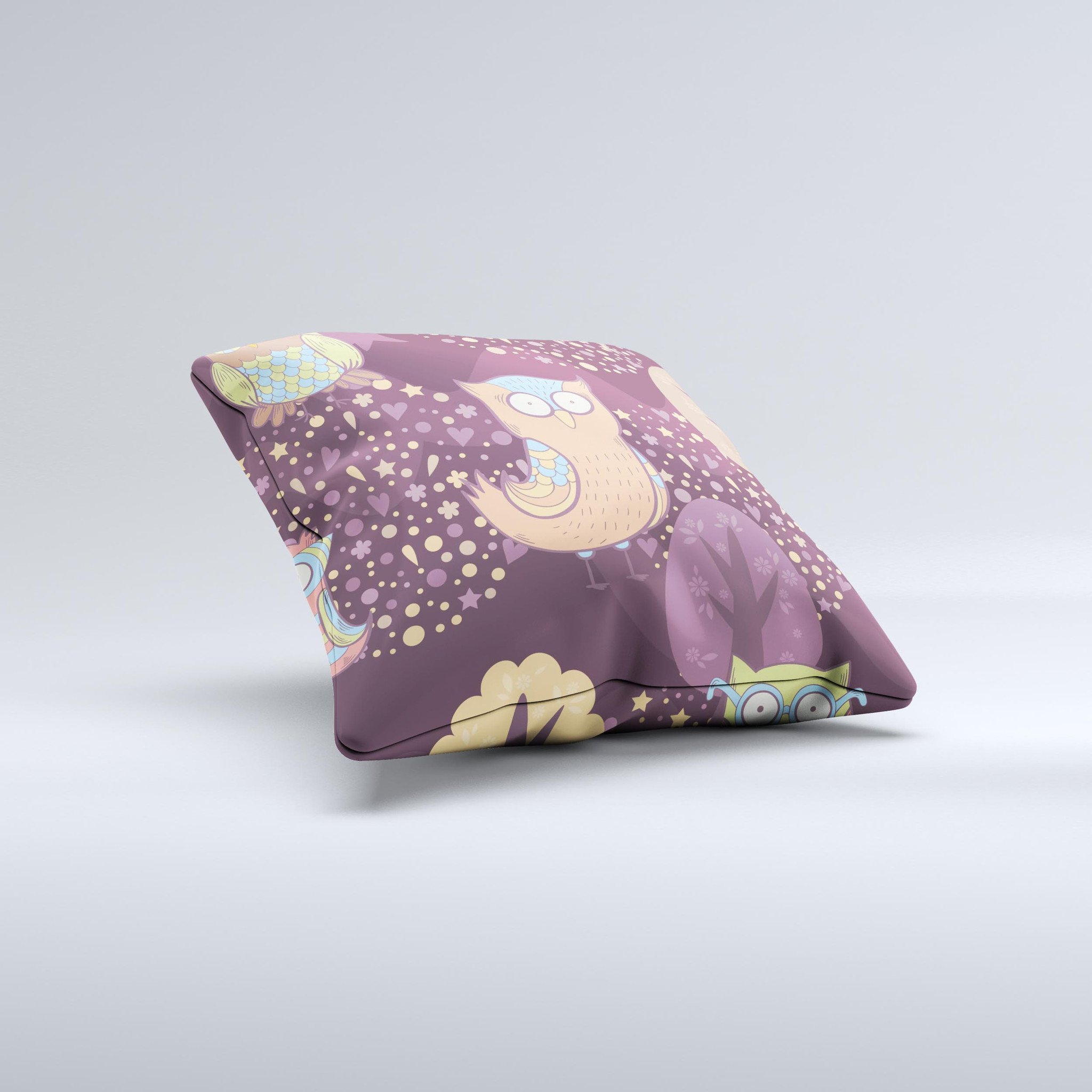 A decorative throw pillow featuring cartoon owls, handcrafted in Virginia with vibrant colors and unique ink-fuzed designs.