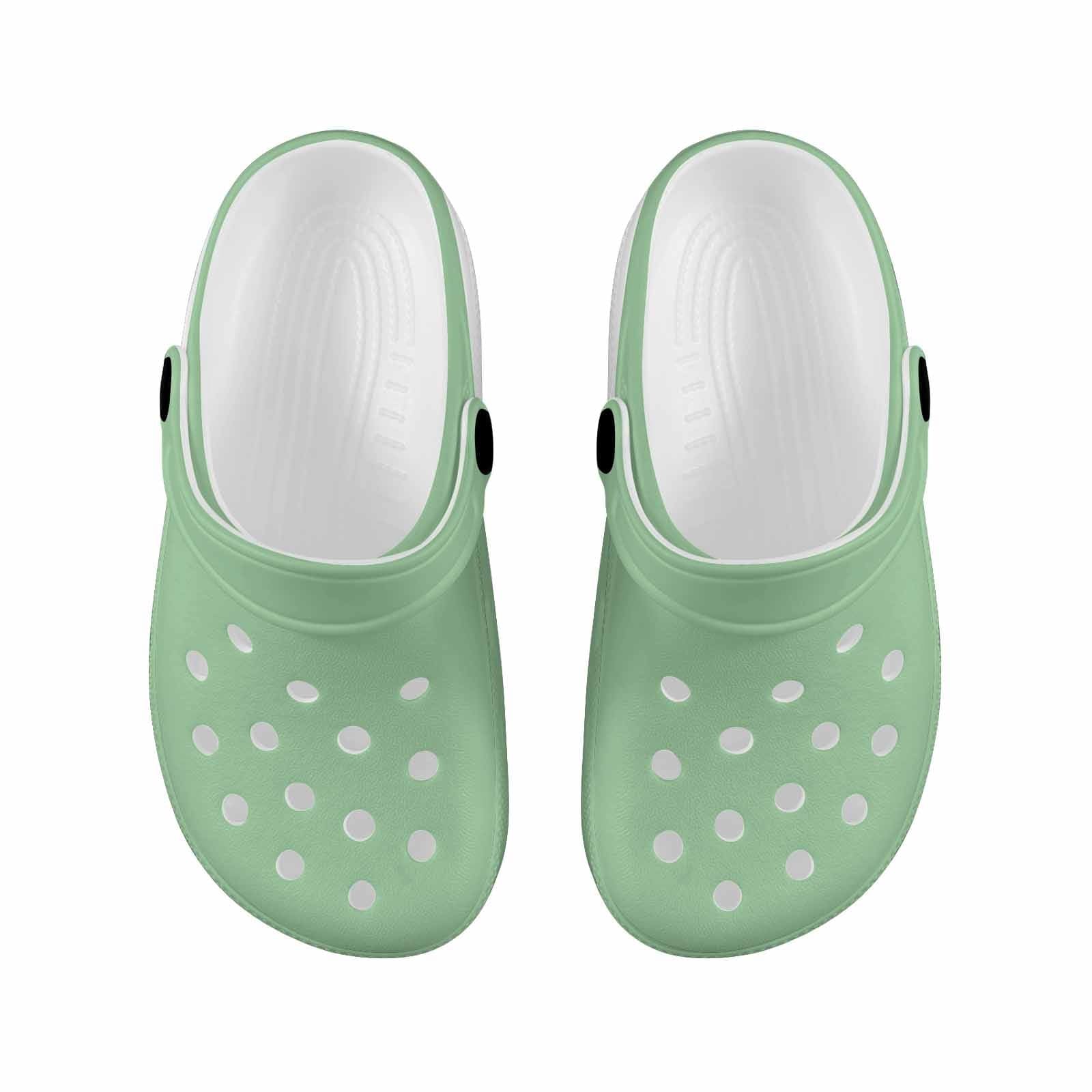 Celadon Green Clogs for Youth featuring a lightweight design, breathable material, and pivoting heel straps for a secure fit.