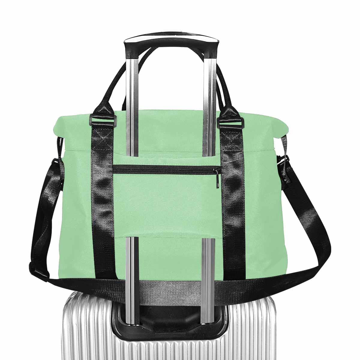 Celadon Green Duffel Bag showcasing its large size and durable oxford fabric, perfect for travel.