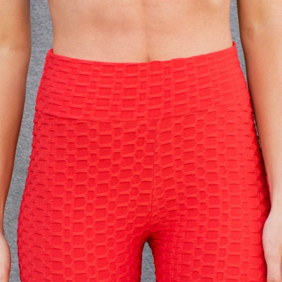 A pair of stylish Cellulite Hiding Capri Leggings in textured fabric, designed to enhance curves and provide comfort.