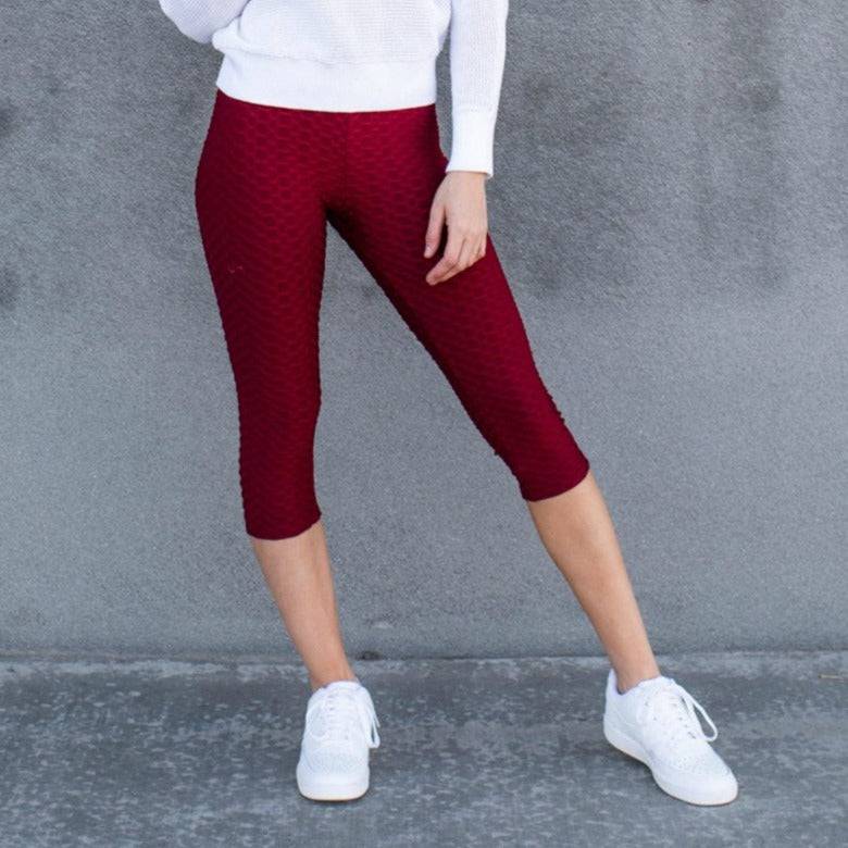 A pair of stylish Cellulite Hiding Capri Leggings in textured fabric, designed to enhance curves and provide comfort.