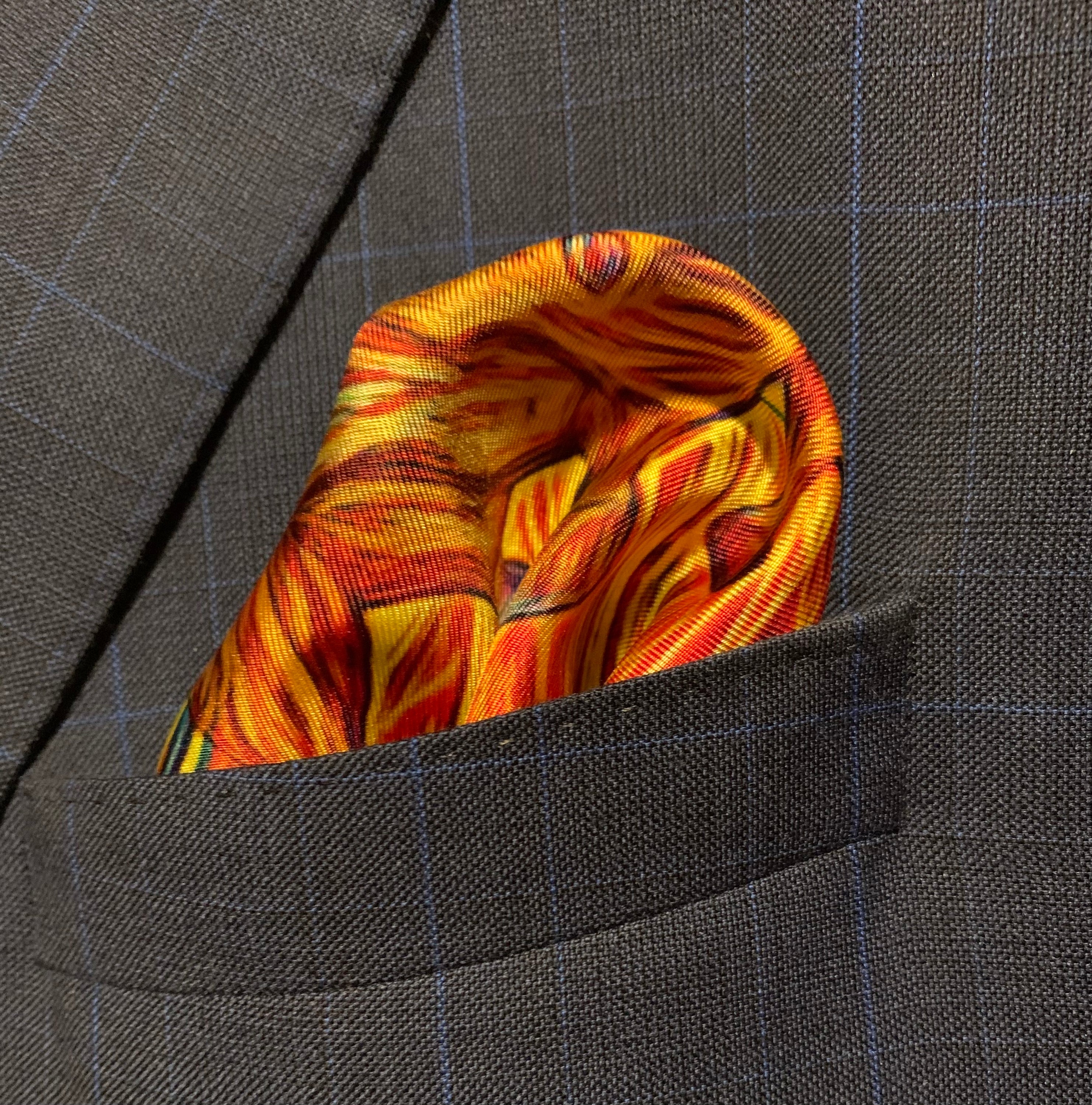 Charging Forward Fire and Ice Pocket Square featuring vibrant colors symbolizing resilience and optimism, elegantly folded.