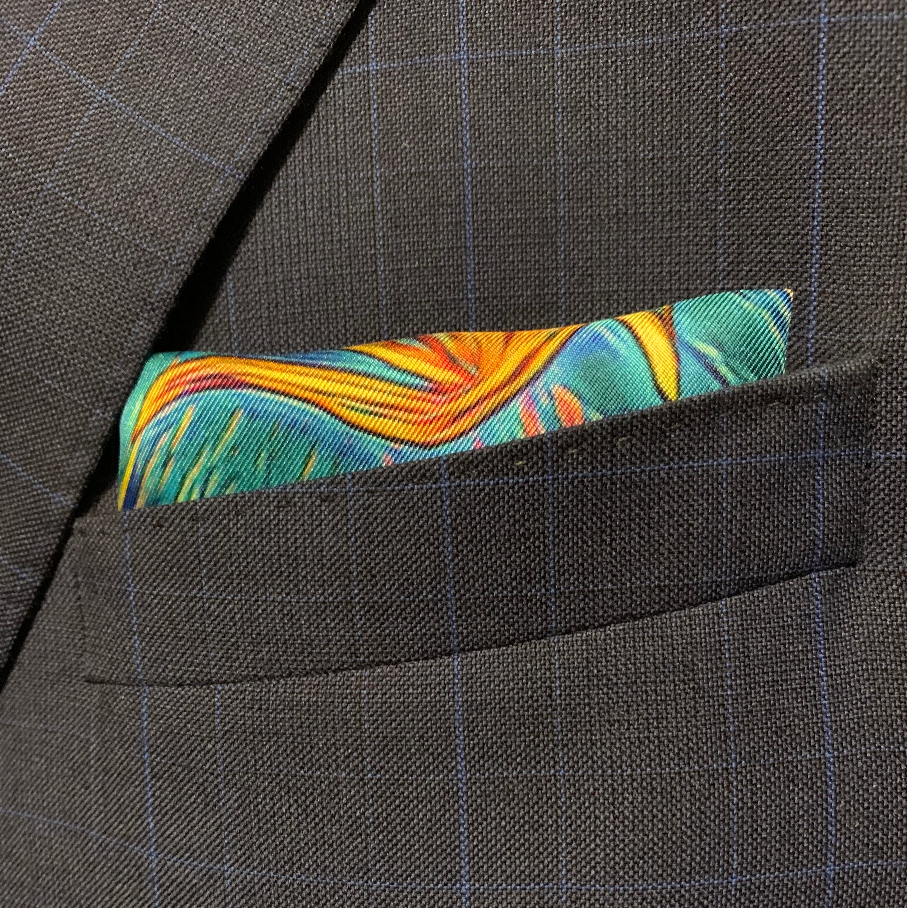 Charging Forward Fire and Ice Pocket Square featuring vibrant colors symbolizing resilience and optimism, elegantly folded.