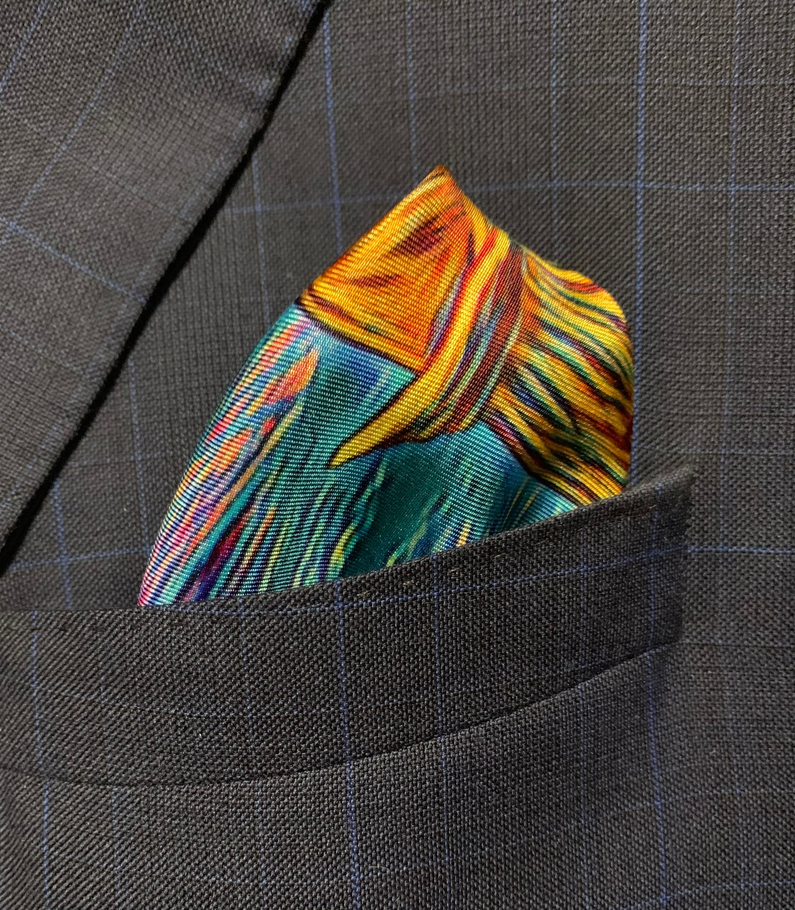 Charging Forward Fire and Ice Pocket Square featuring vibrant colors symbolizing resilience and optimism, elegantly folded.