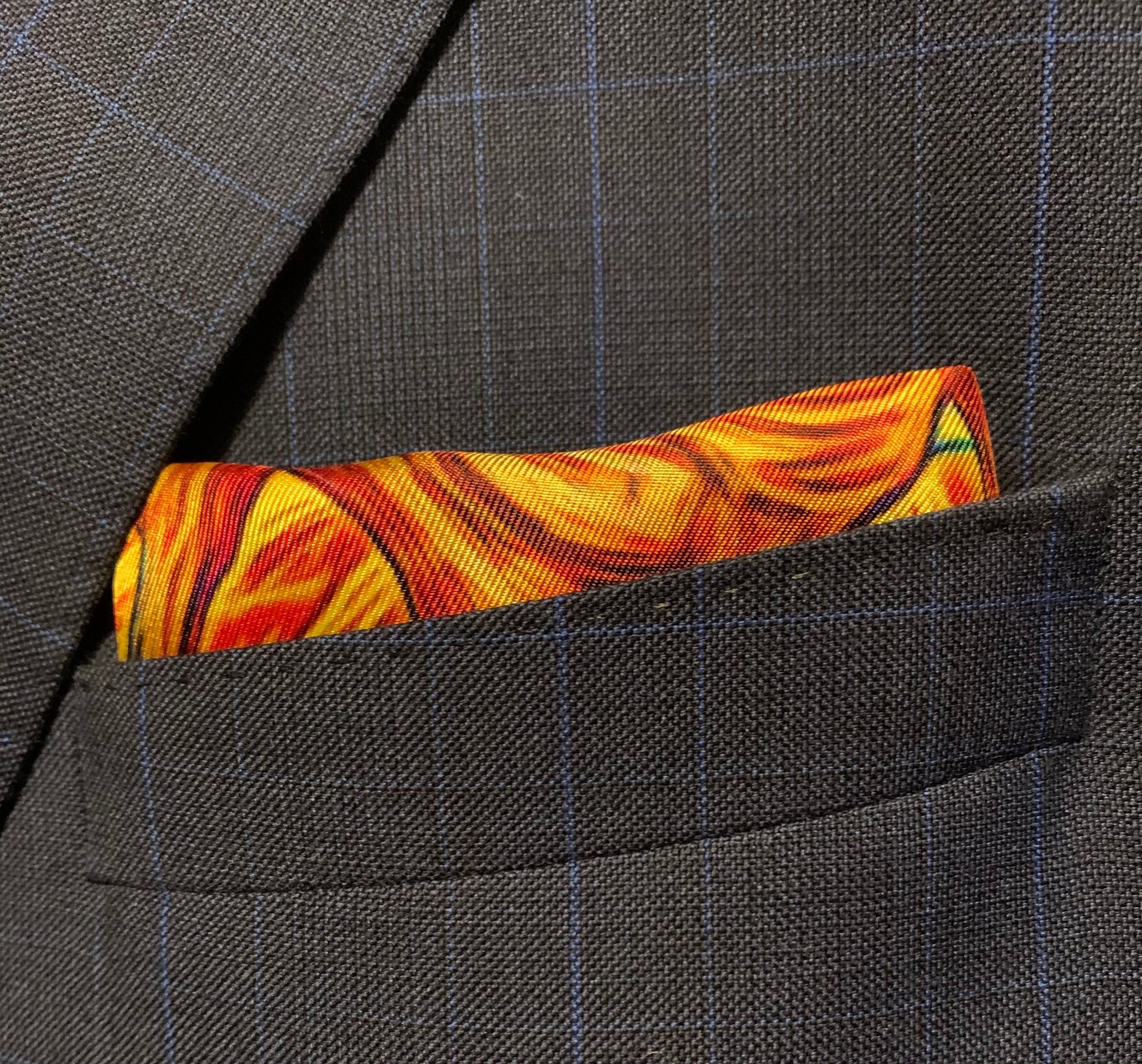 Charging Forward Fire and Ice Pocket Square featuring vibrant colors symbolizing resilience and optimism, elegantly folded.