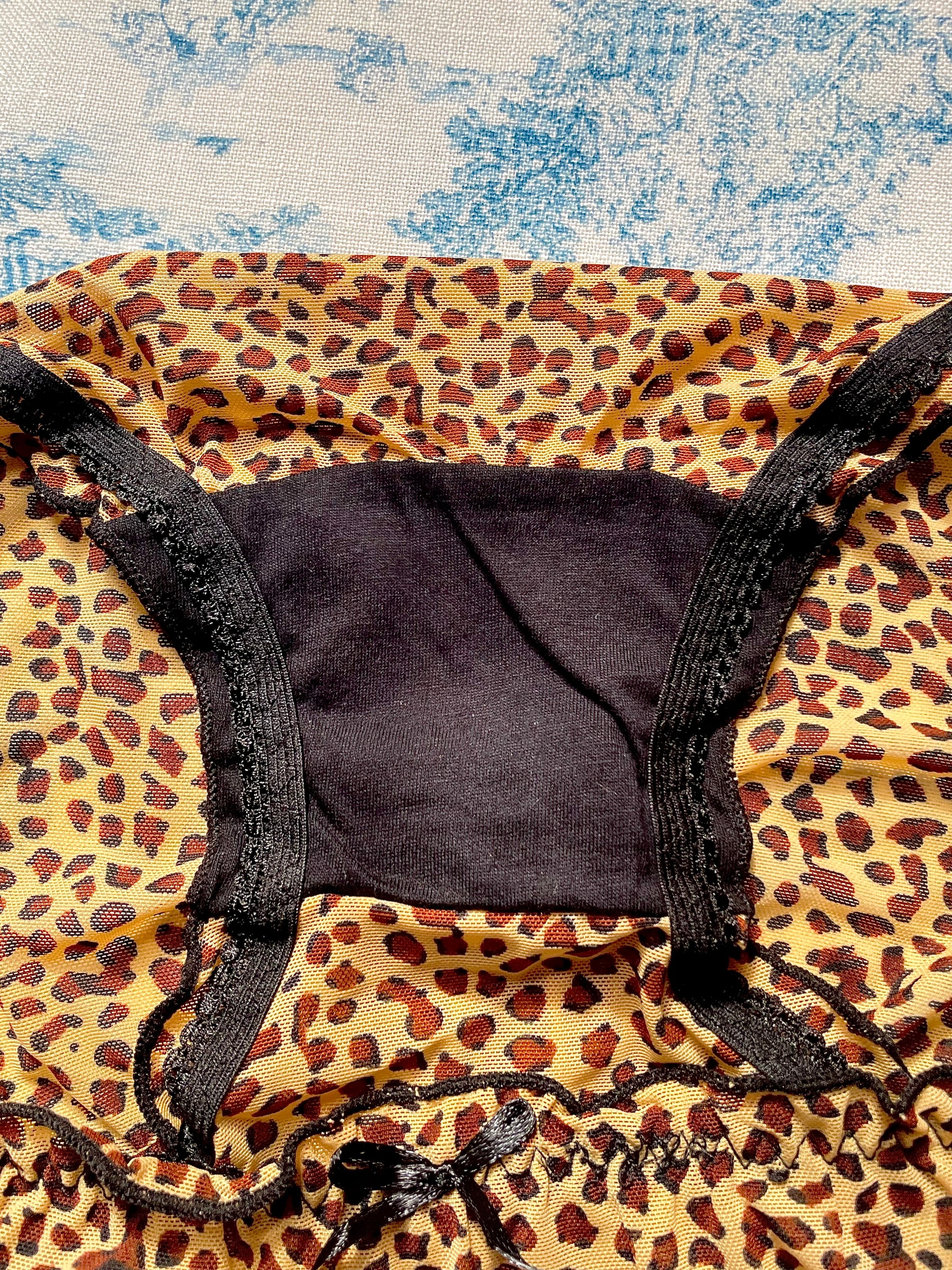 Cheetah Print Panty featuring black lettuce trim and bow detail, made with 100% cotton lining for comfort.