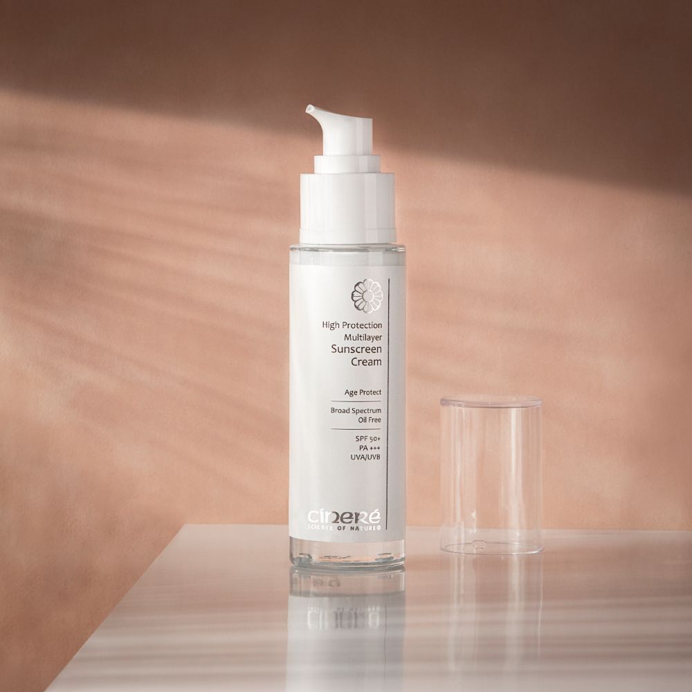 Cinere High Protection Multi-Layer Sunscreen Cream SPF 50+ in a sleek tube, showcasing its lightweight and non-greasy texture.