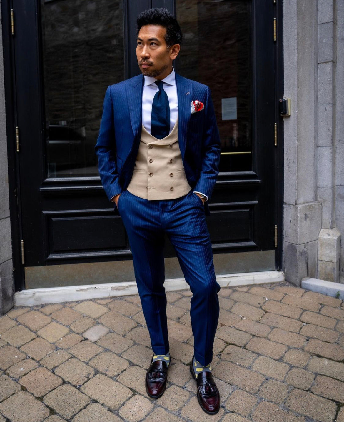 Classic London Pocket Square featuring hand-sketched London landmarks in blue and red silk.