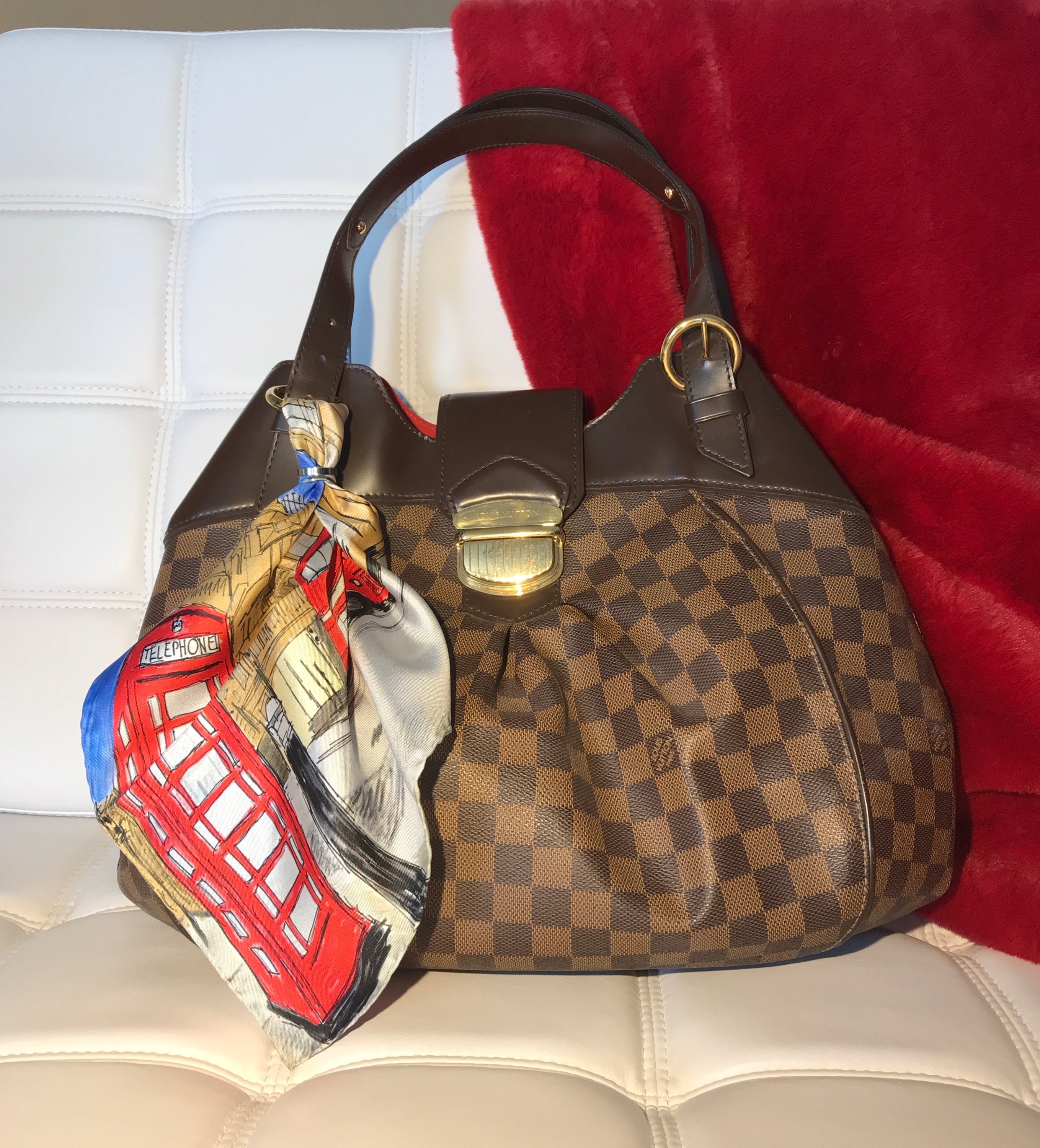 Classic London Pocket Square featuring hand-sketched London landmarks in blue and red silk.