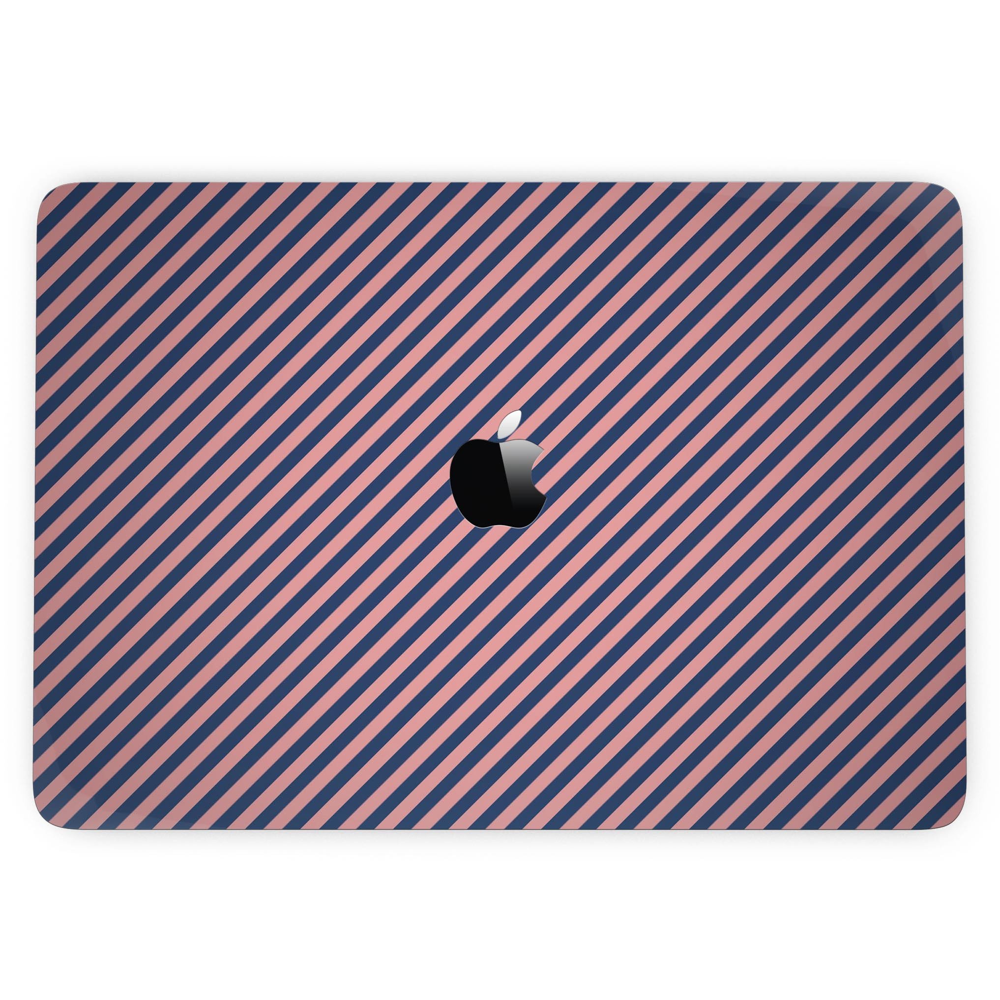 Coral and navy blue diagonal stripes skin for MacBook Pro with Touch Bar, showcasing vibrant colors and a sleek design.