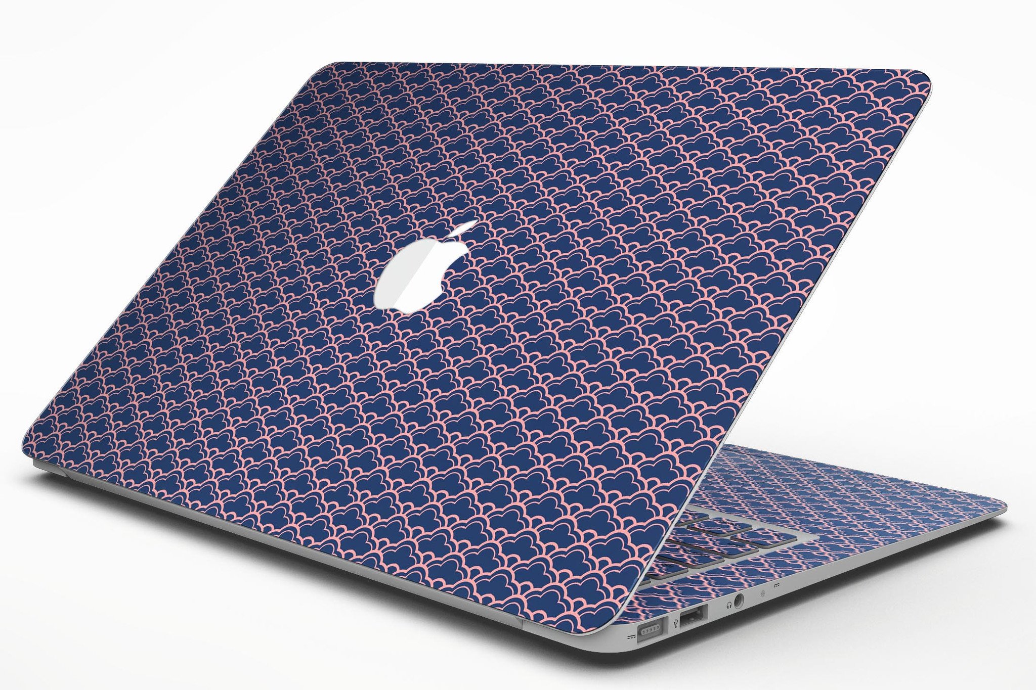 Coral and Navy Micro Cloud Pattern skin applied to a MacBook Air, showcasing its vibrant design and sleek fit.