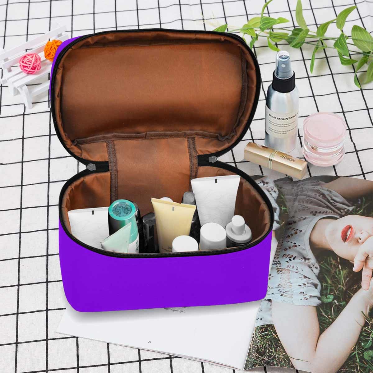 Violet travel case cosmetic bag with multiple compartments and zipper closure, perfect for organizing beauty essentials.