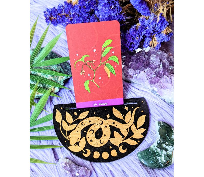 Cosmic Serpent Oracle Card Holder displaying a tarot card, featuring intricate serpent designs.