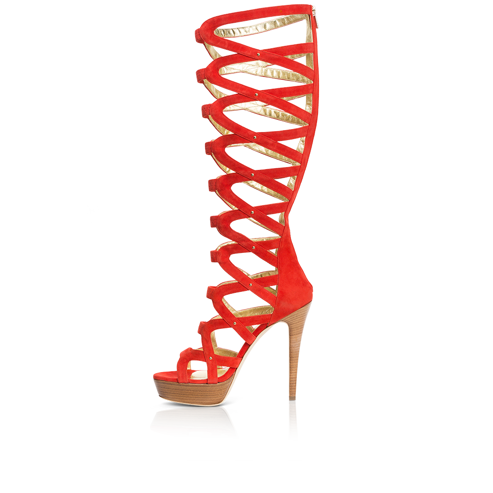 Courage stiletto featuring crimson suede, stud details, and a gold zipper, set on a wood veneer platform.