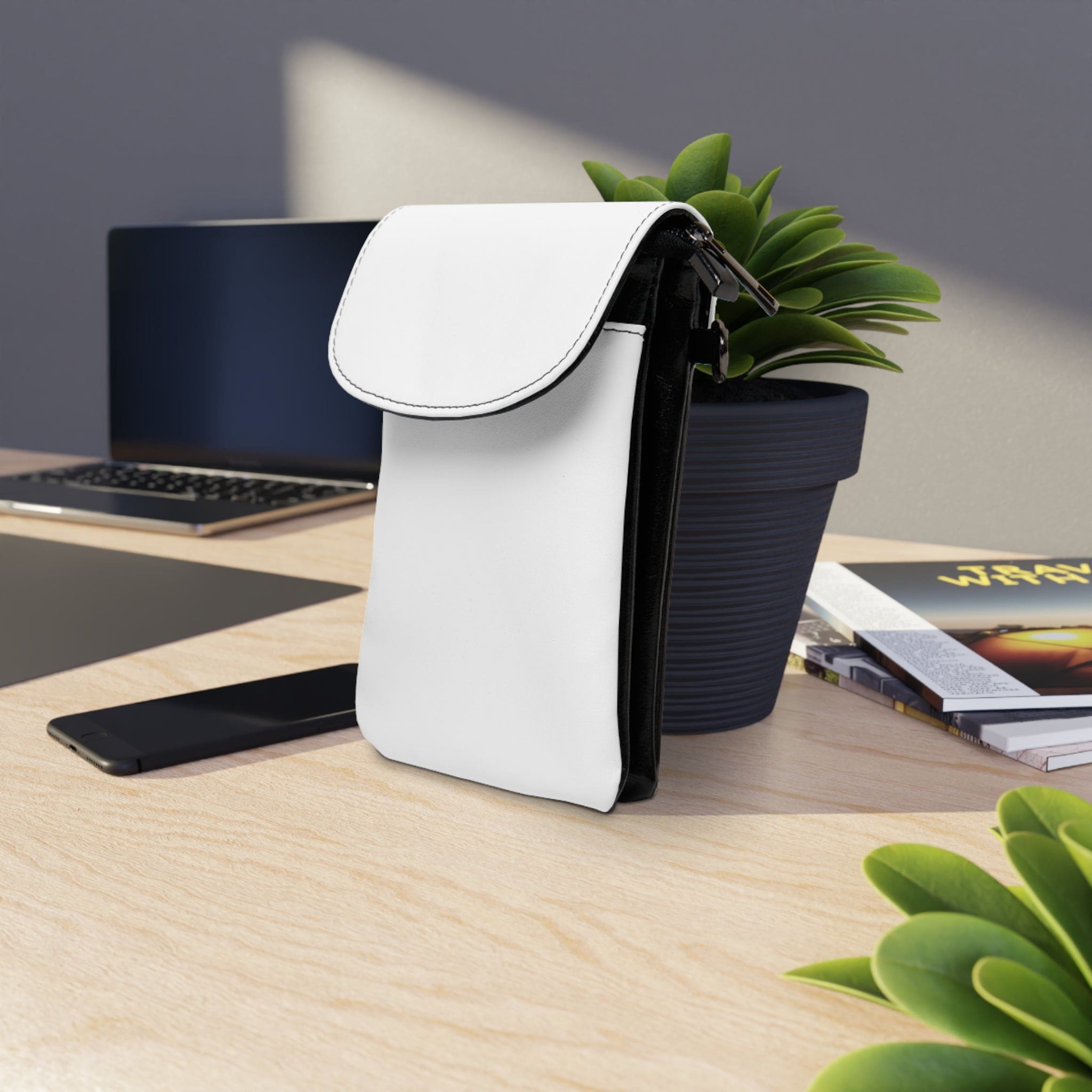 A stylish small crossbody bag made of high-grade faux leather, featuring adjustable strap and compartments for phone and cards.