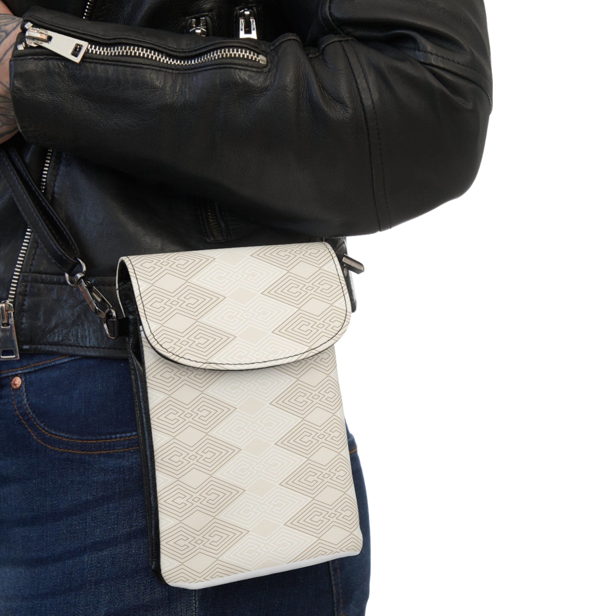 Beige and white tribal crossbody bag with geometric print, featuring adjustable strap and multiple compartments for phone and cards.