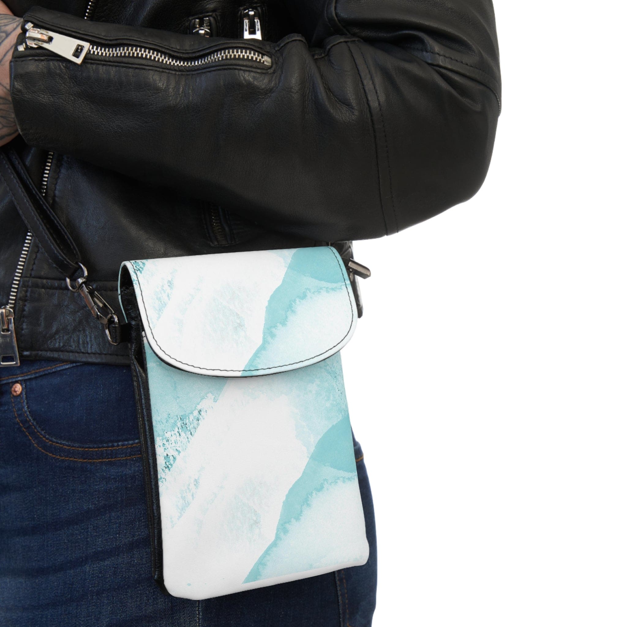 Stylish crossbody bag in ocean blue and white abstract print, featuring adjustable strap and multiple compartments for phone and cards.