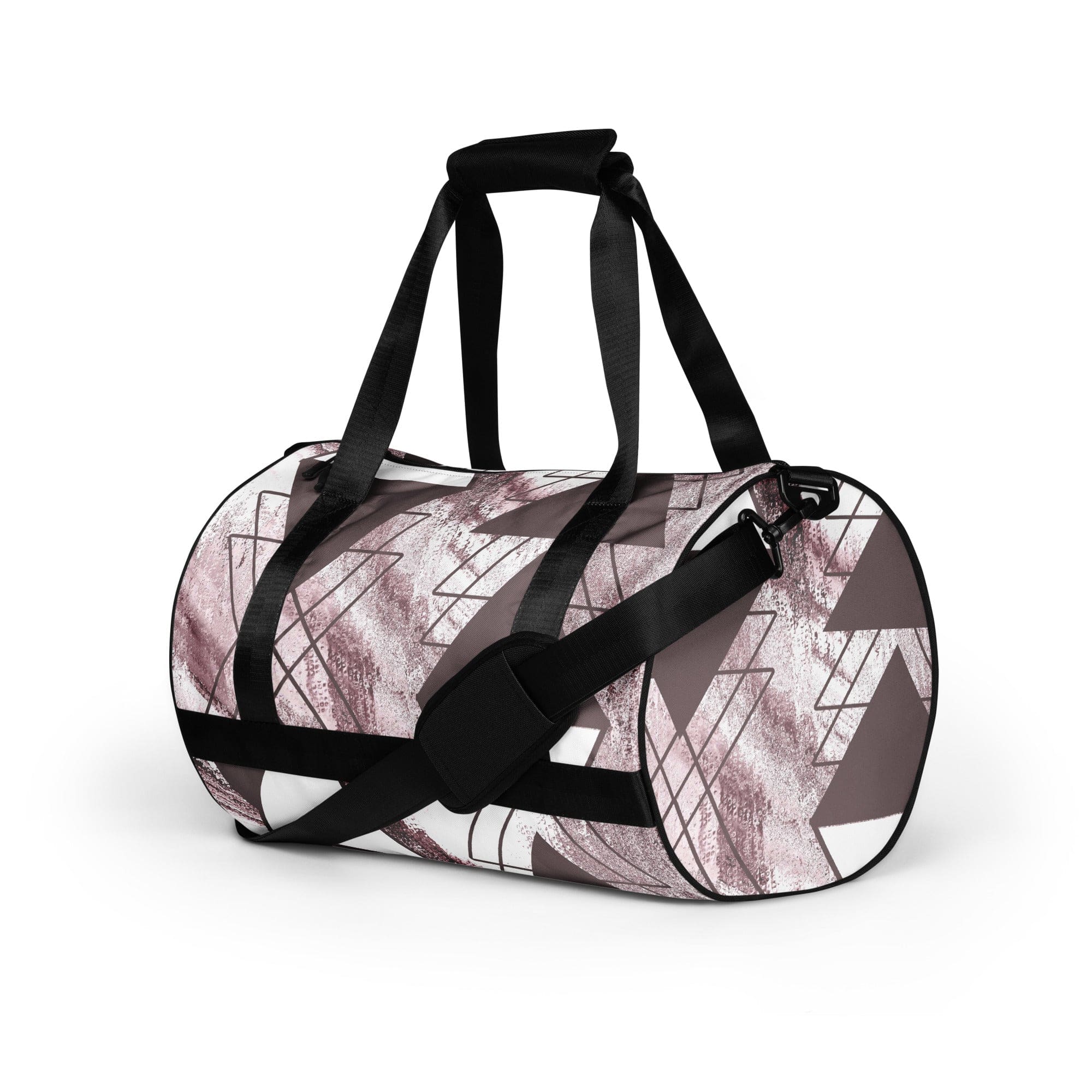 Crossbody water-resistant travel bag in mauve rose and white triangular colorblock, featuring dual padded handles and multiple pockets.