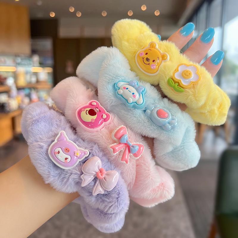 A set of four cute fluffy scrunchies with big ears, showcasing their soft texture and vibrant colors, perfect for stylish hairstyles.