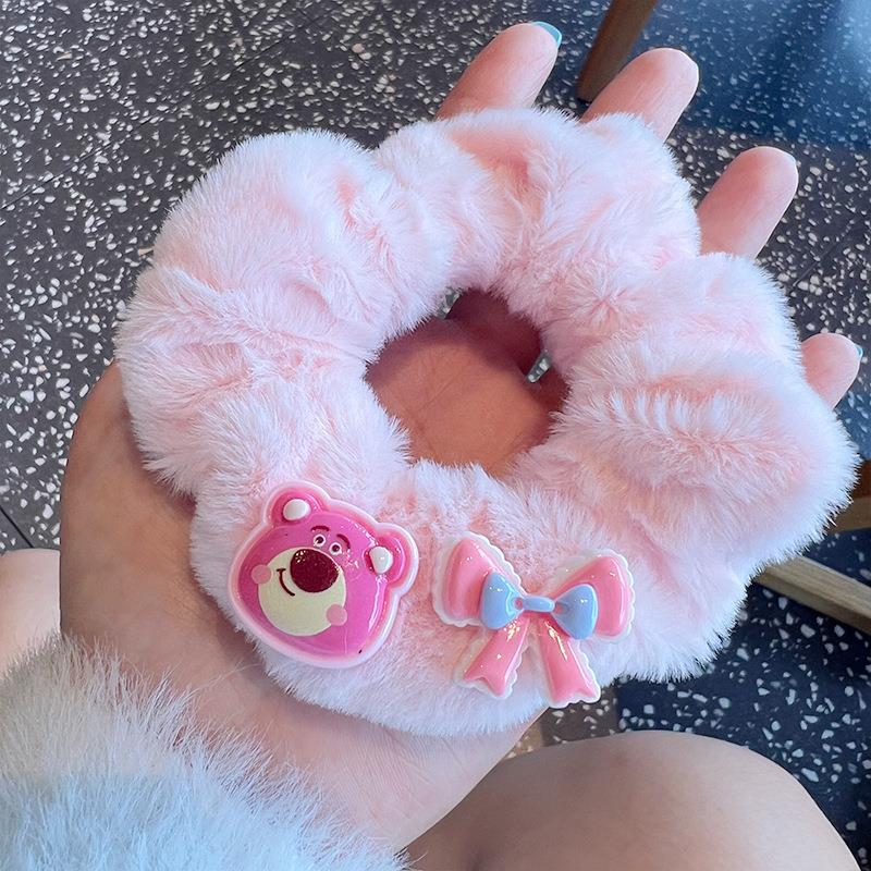 A set of four cute fluffy scrunchies with big ears, showcasing their soft texture and vibrant colors, perfect for stylish hairstyles.