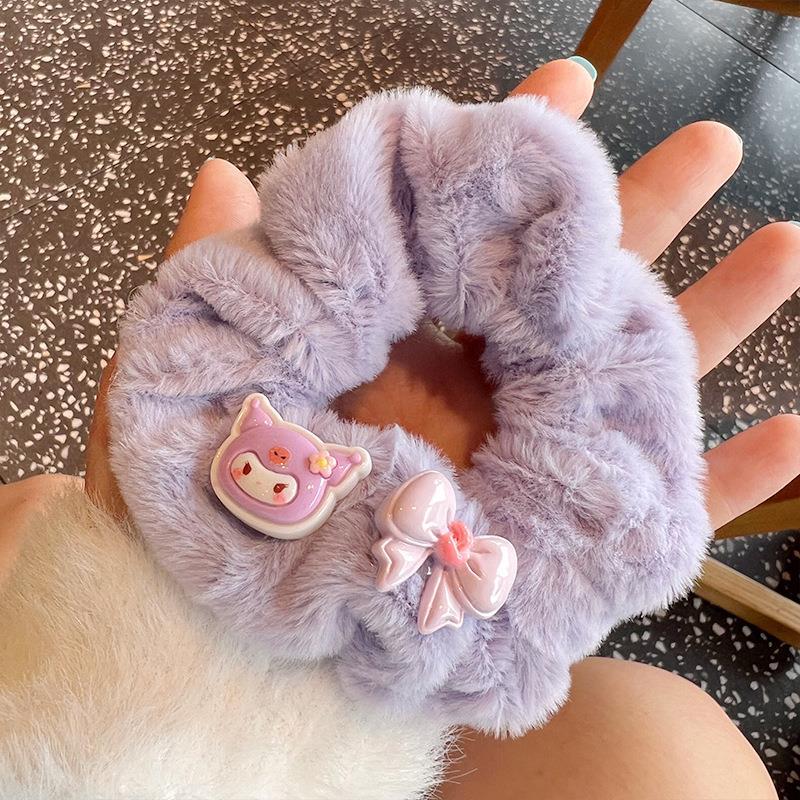 A set of four cute fluffy scrunchies with big ears, showcasing their soft texture and vibrant colors, perfect for stylish hairstyles.