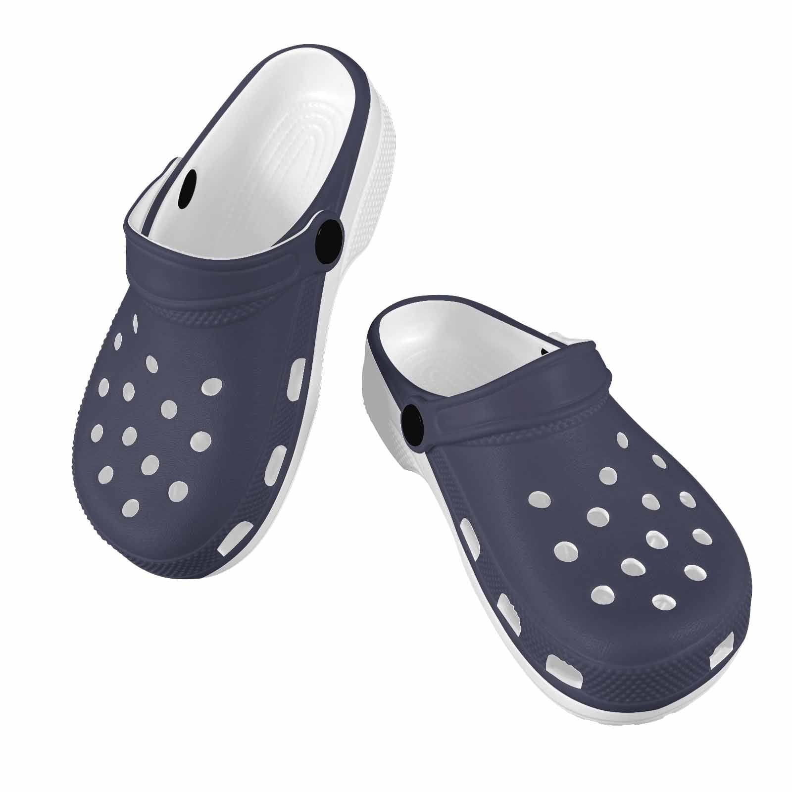 A pair of dark blue clogs designed for youth, featuring a slip-on design, ventilation ports, and cushioned soles for comfort.
