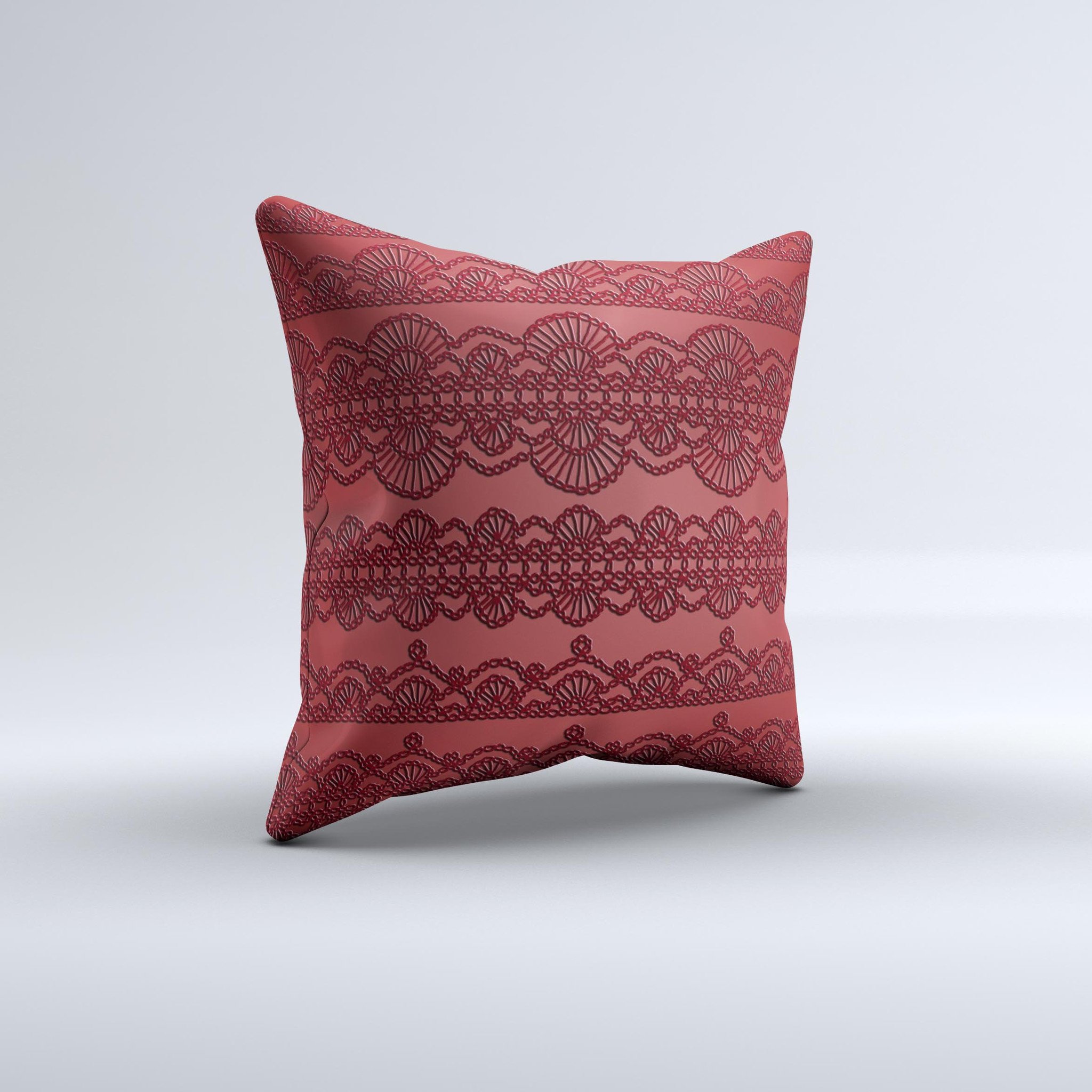 Dark red decorative throw pillow with lace pattern, handcrafted in Virginia, showcasing unique design and high-quality fabric.
