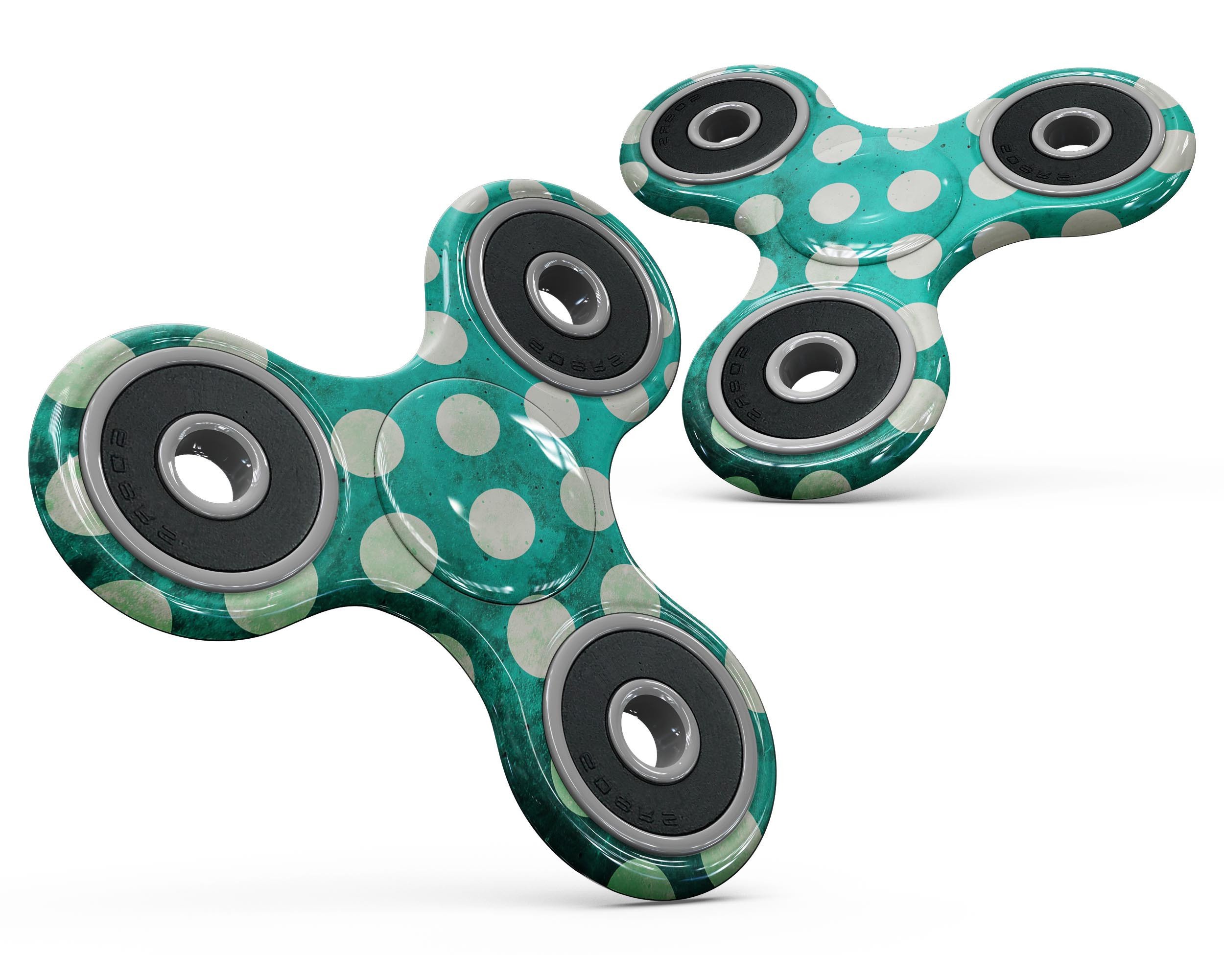 Dark teal fidget spinner skin with white polka dots pattern, showcasing a stylish design for personalization and protection.