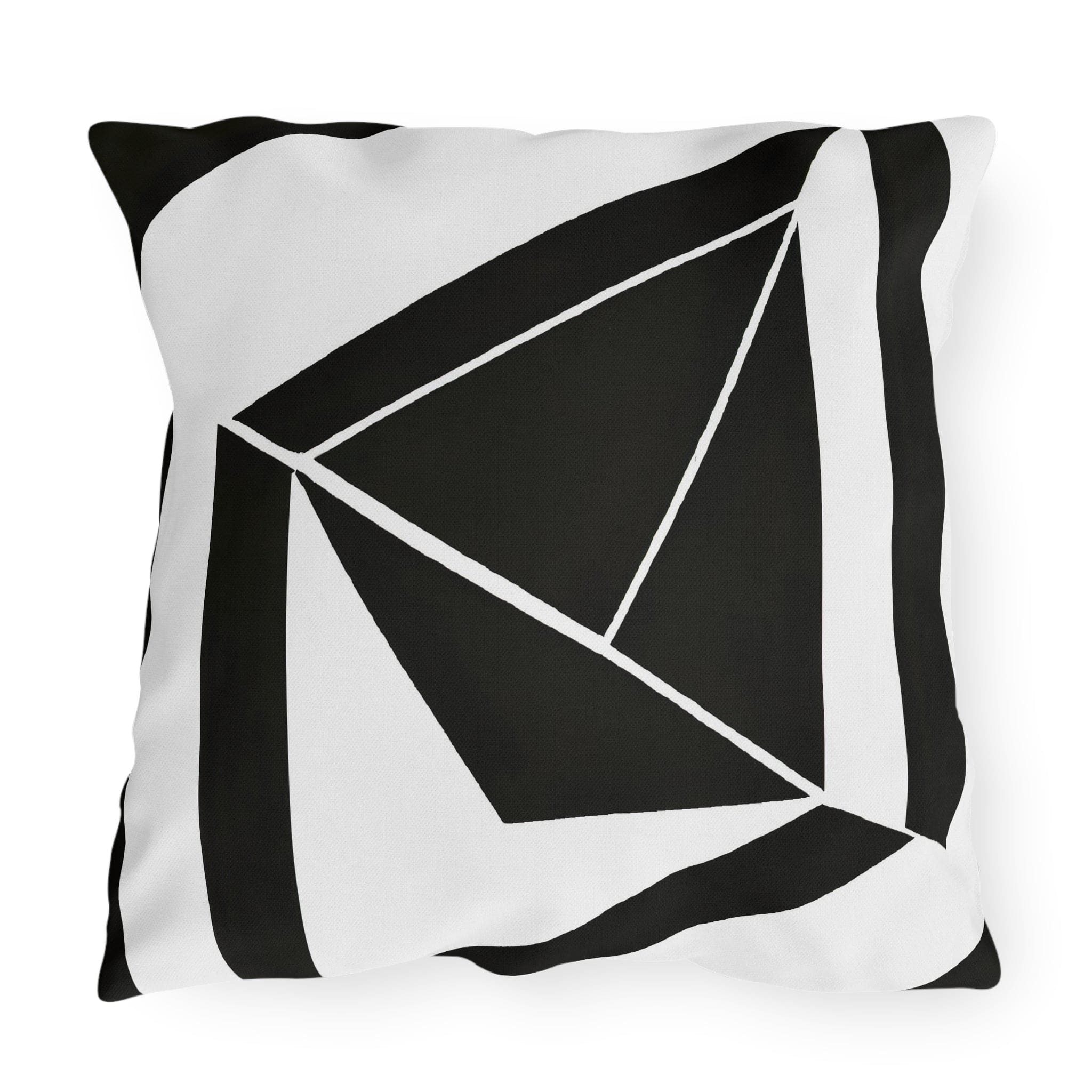 Decorative indoor/outdoor pillow featuring a black and white geometric pattern, ideal for enhancing outdoor spaces.