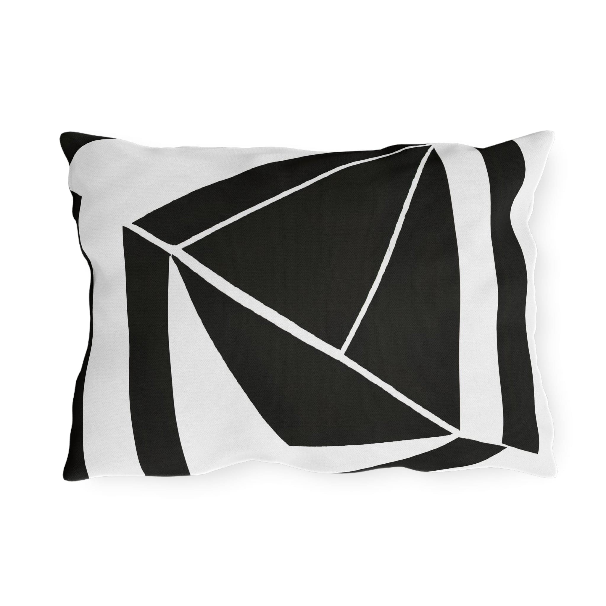 Decorative indoor/outdoor pillow featuring a black and white geometric pattern, ideal for enhancing outdoor spaces.