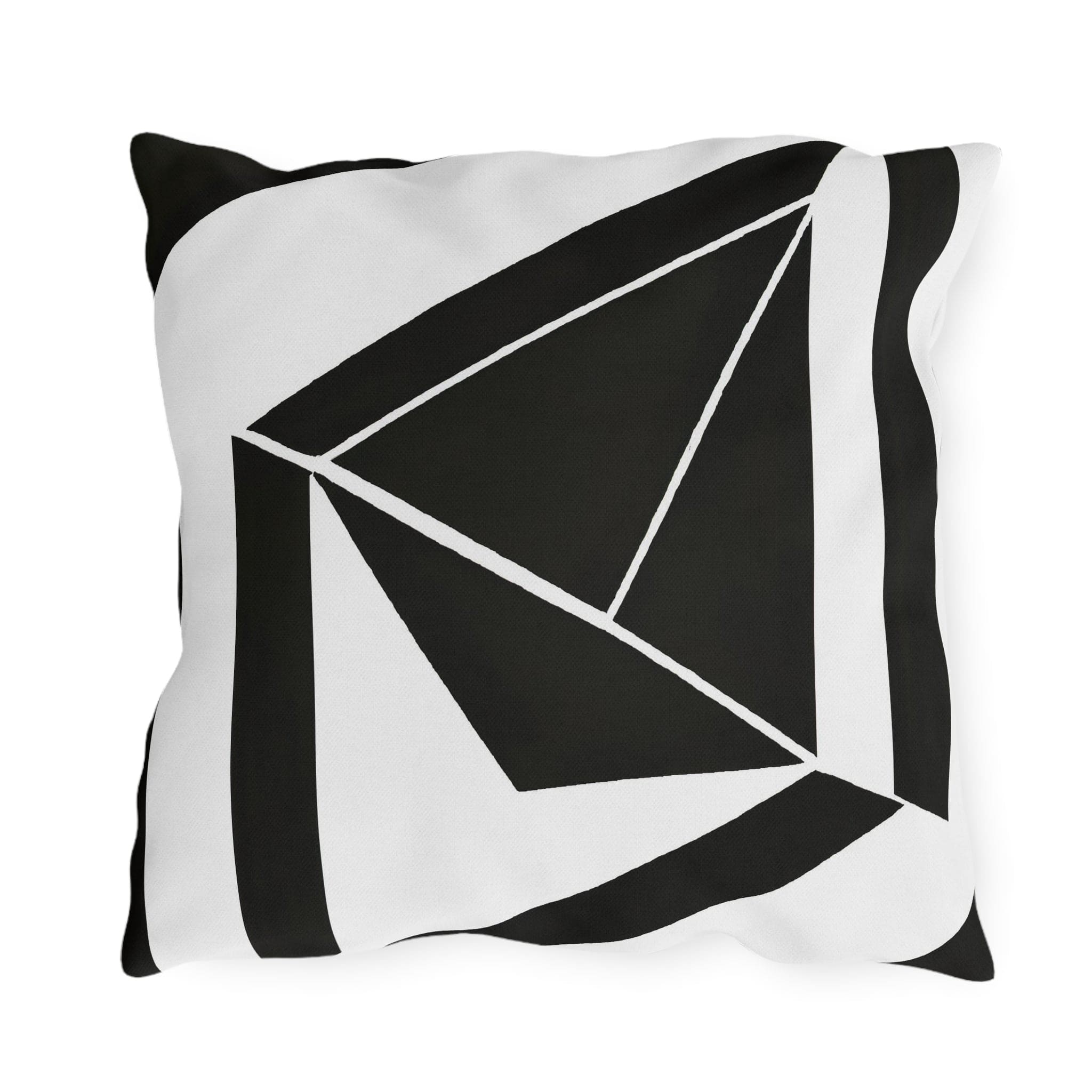 Decorative indoor/outdoor pillow featuring a black and white geometric pattern, ideal for enhancing outdoor spaces.