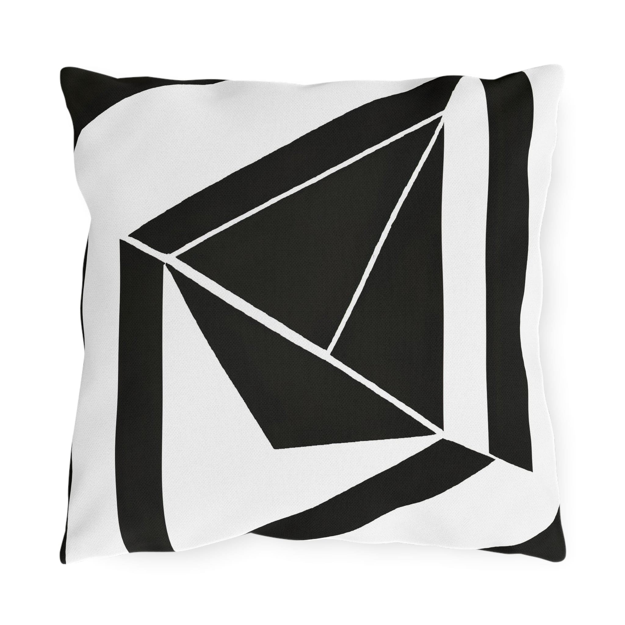 Decorative indoor/outdoor pillow featuring a black and white geometric pattern, ideal for enhancing outdoor spaces.