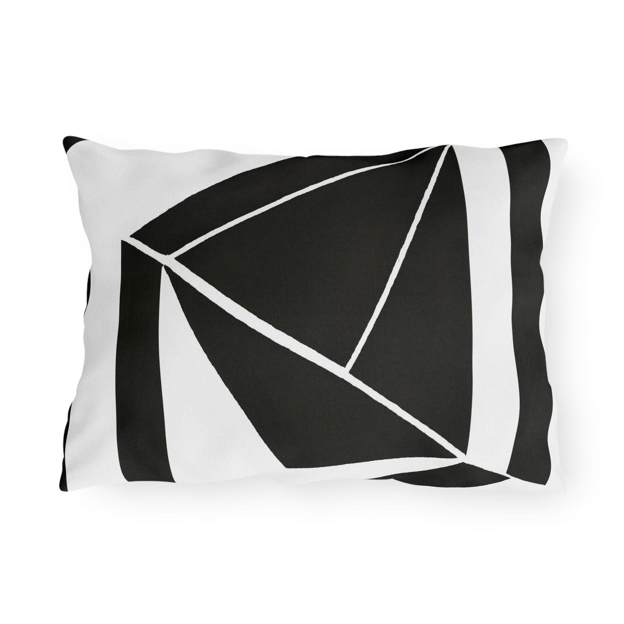 Decorative indoor/outdoor pillow featuring a black and white geometric pattern, ideal for enhancing outdoor spaces.