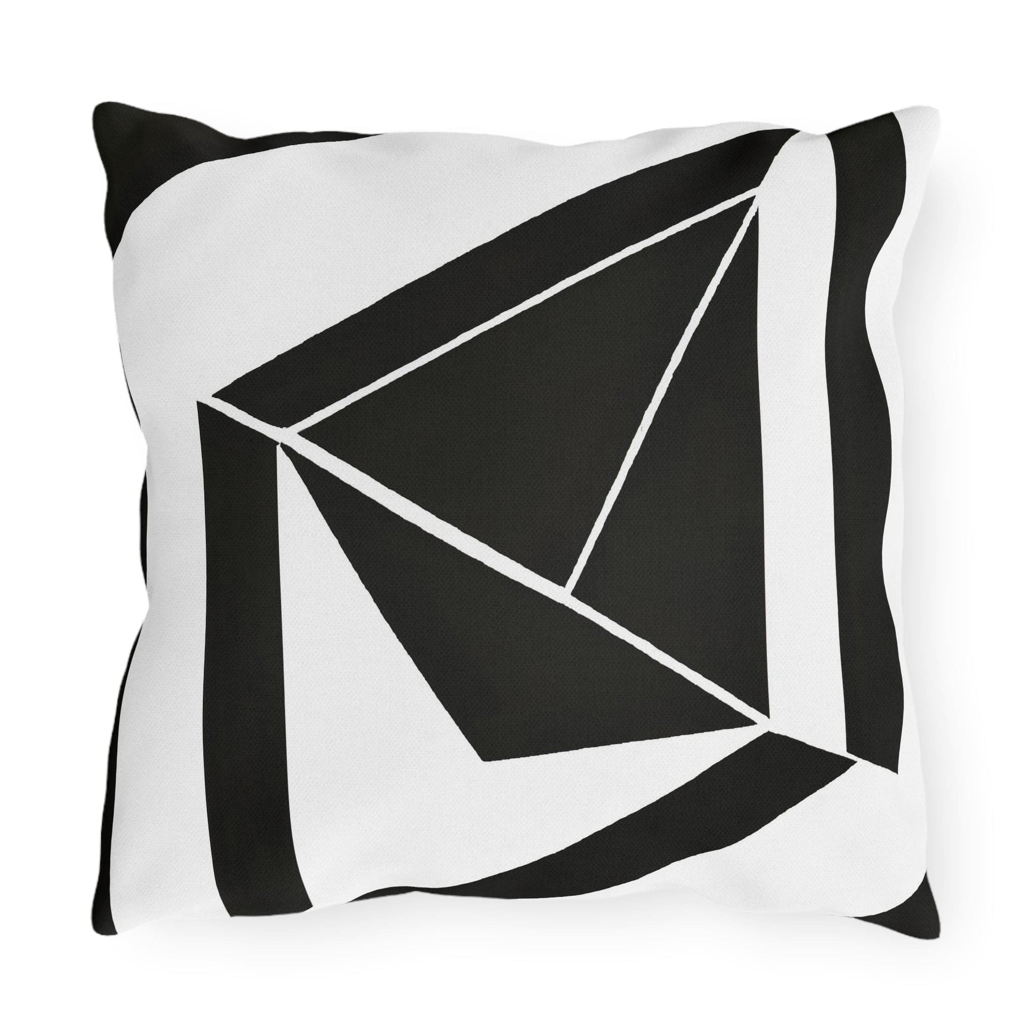 Decorative indoor/outdoor pillow featuring a black and white geometric pattern, ideal for enhancing outdoor spaces.