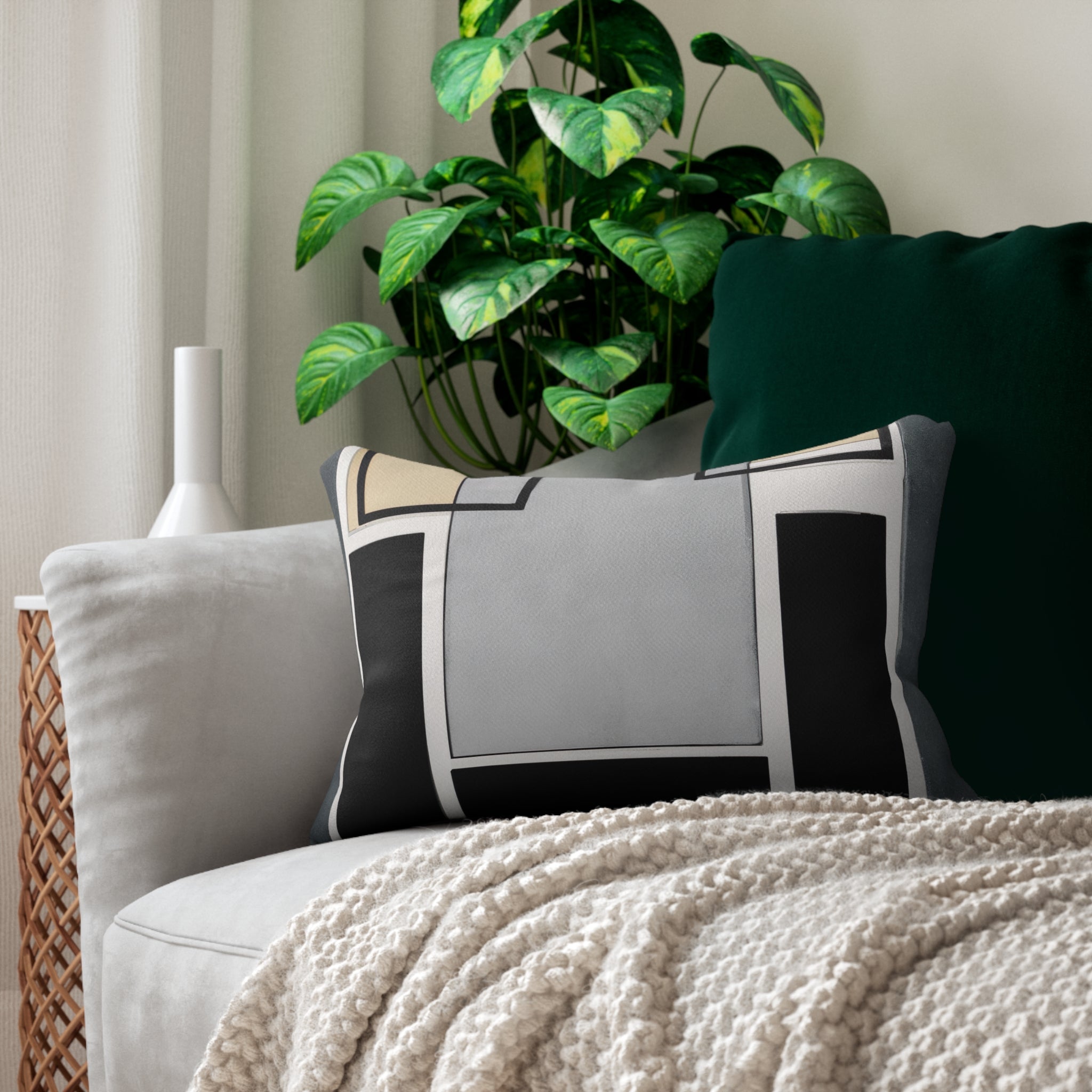 Decorative lumbar throw pillow featuring an abstract geometric design in black, grey, and brown colors, perfect for enhancing home decor.