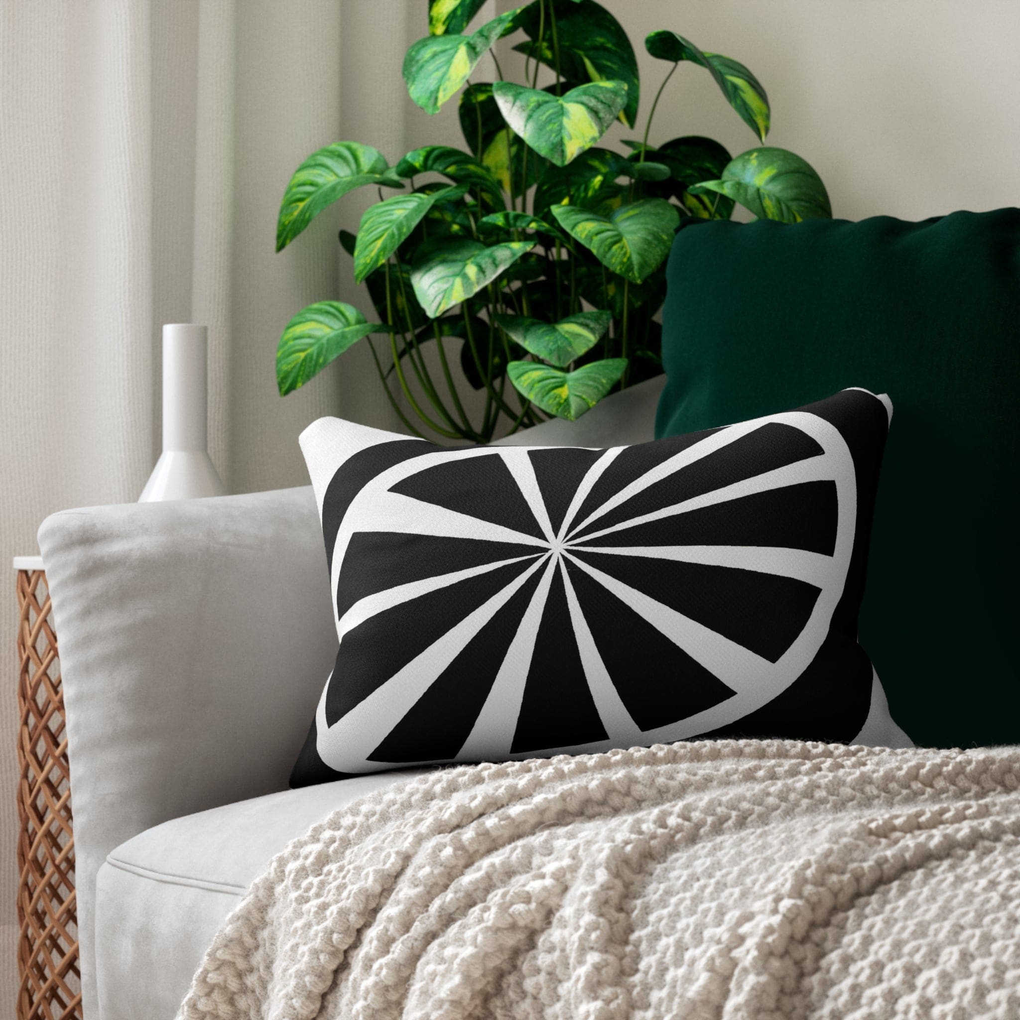 Decorative lumbar throw pillow featuring a black and white geometric pattern, showcasing its stylish design and plush texture.