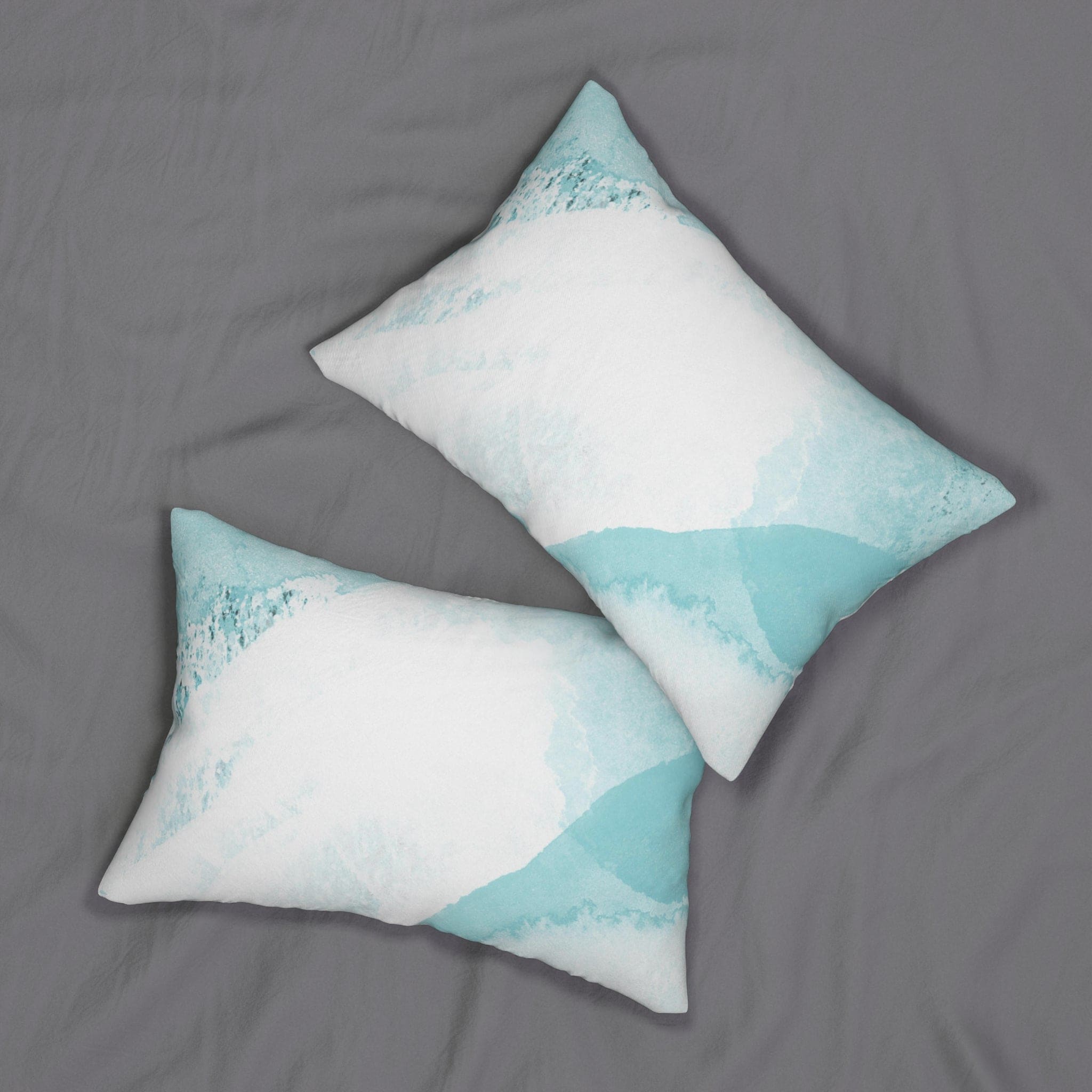 Decorative lumbar throw pillow featuring an abstract ocean blue and white design, perfect for adding artistic flair to any room.
