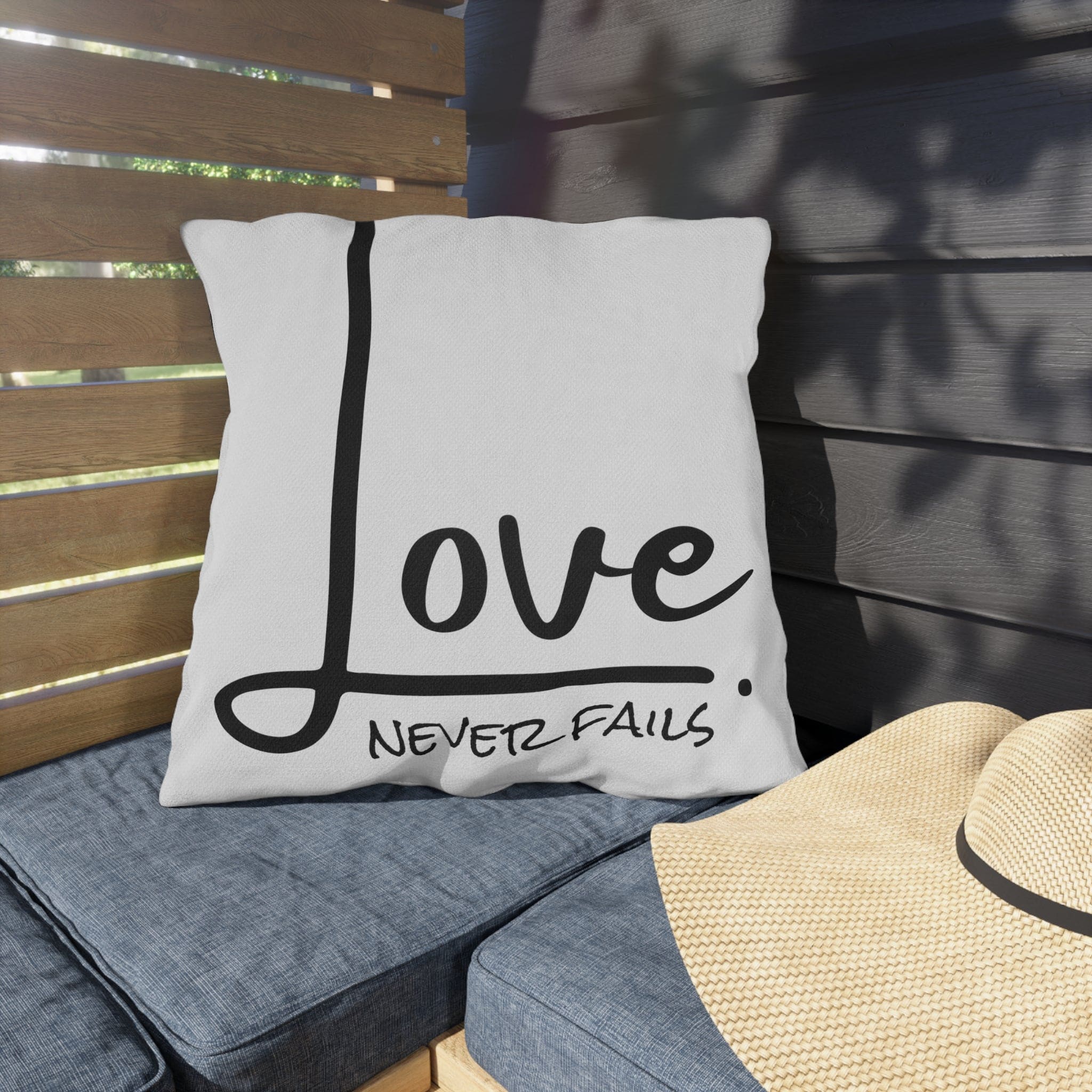 Decorative throw pillow cover featuring 'Love Never Fails' design, made from high-quality polyester with a concealed zipper.