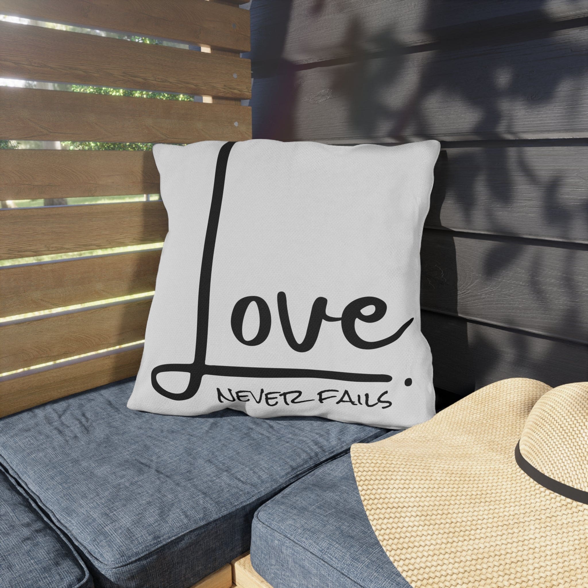Decorative throw pillow cover featuring 'Love Never Fails' design, made from high-quality polyester with a concealed zipper.