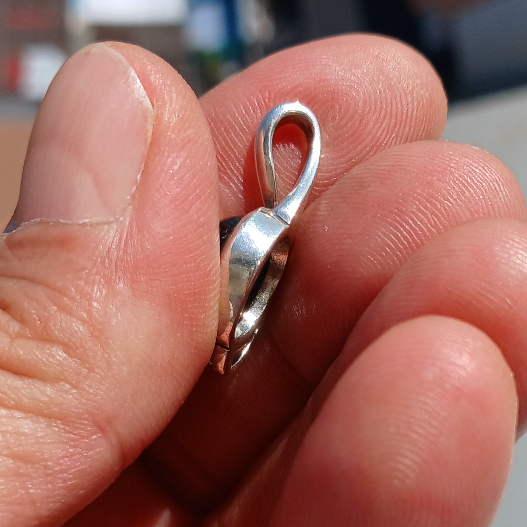A stunning Black Star Diopside pendant in sterling silver, showcasing a unique 4-ray star pattern, elegantly crafted and hallmarked 925.