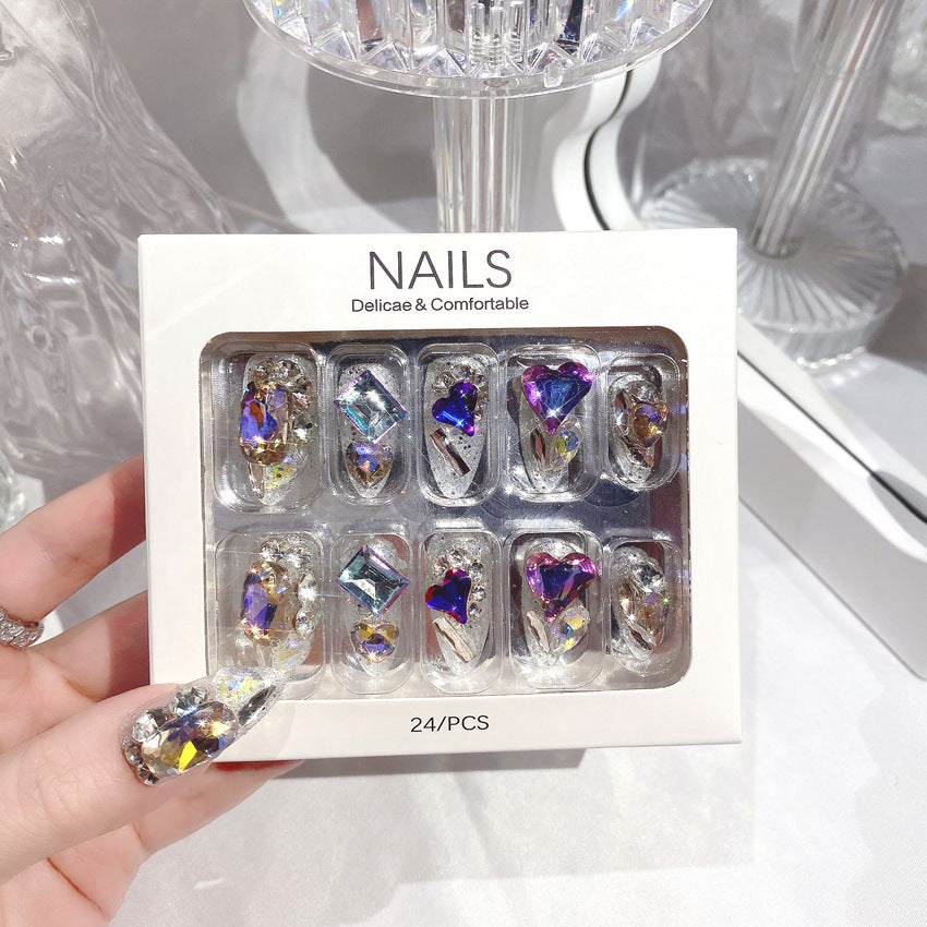 A beautifully arranged 24-piece set of sparkling gem fake nails, showcasing various designs and colors, perfect for bridal nail art.