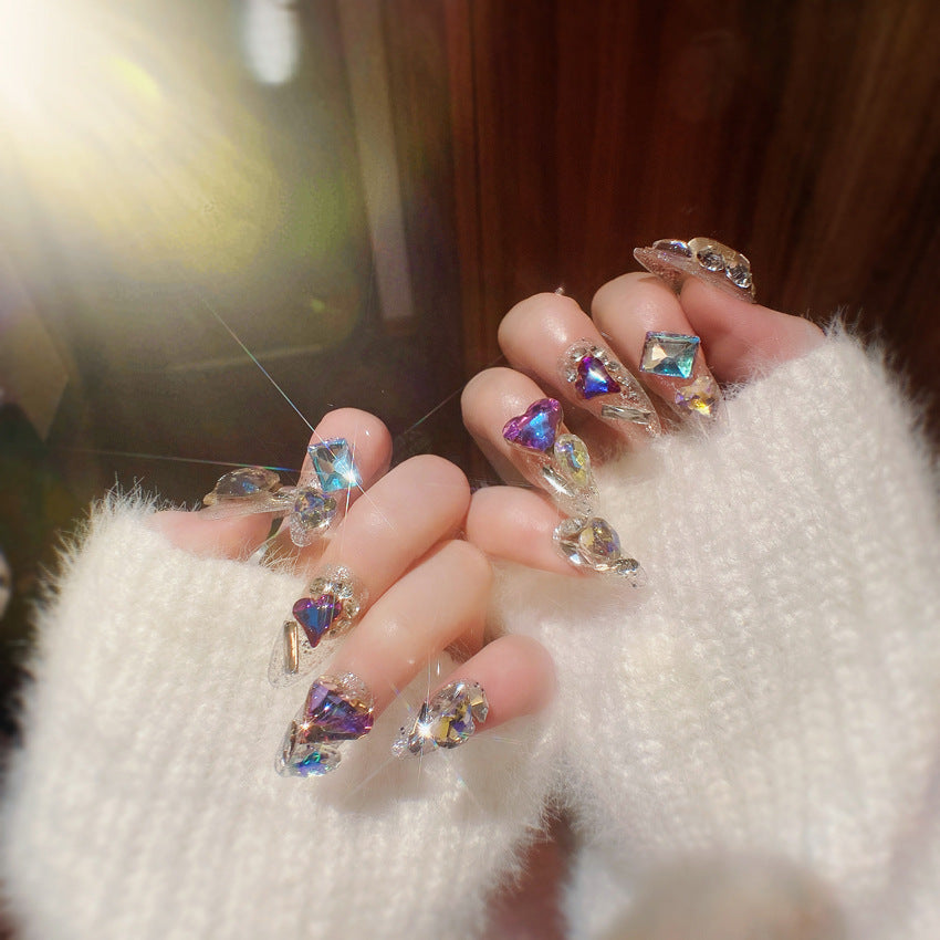 A beautifully arranged 24-piece set of sparkling gem fake nails, showcasing various designs and colors, perfect for bridal nail art.