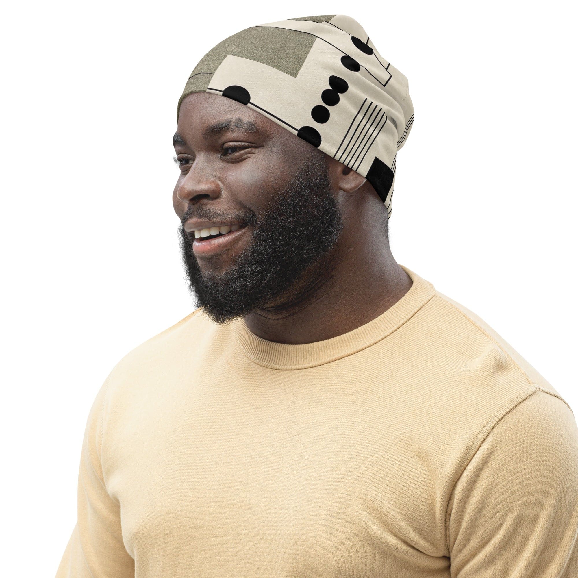 Double-layered beanie hat featuring abstract black, beige, and brown geometric shapes, perfect for stylish warmth.