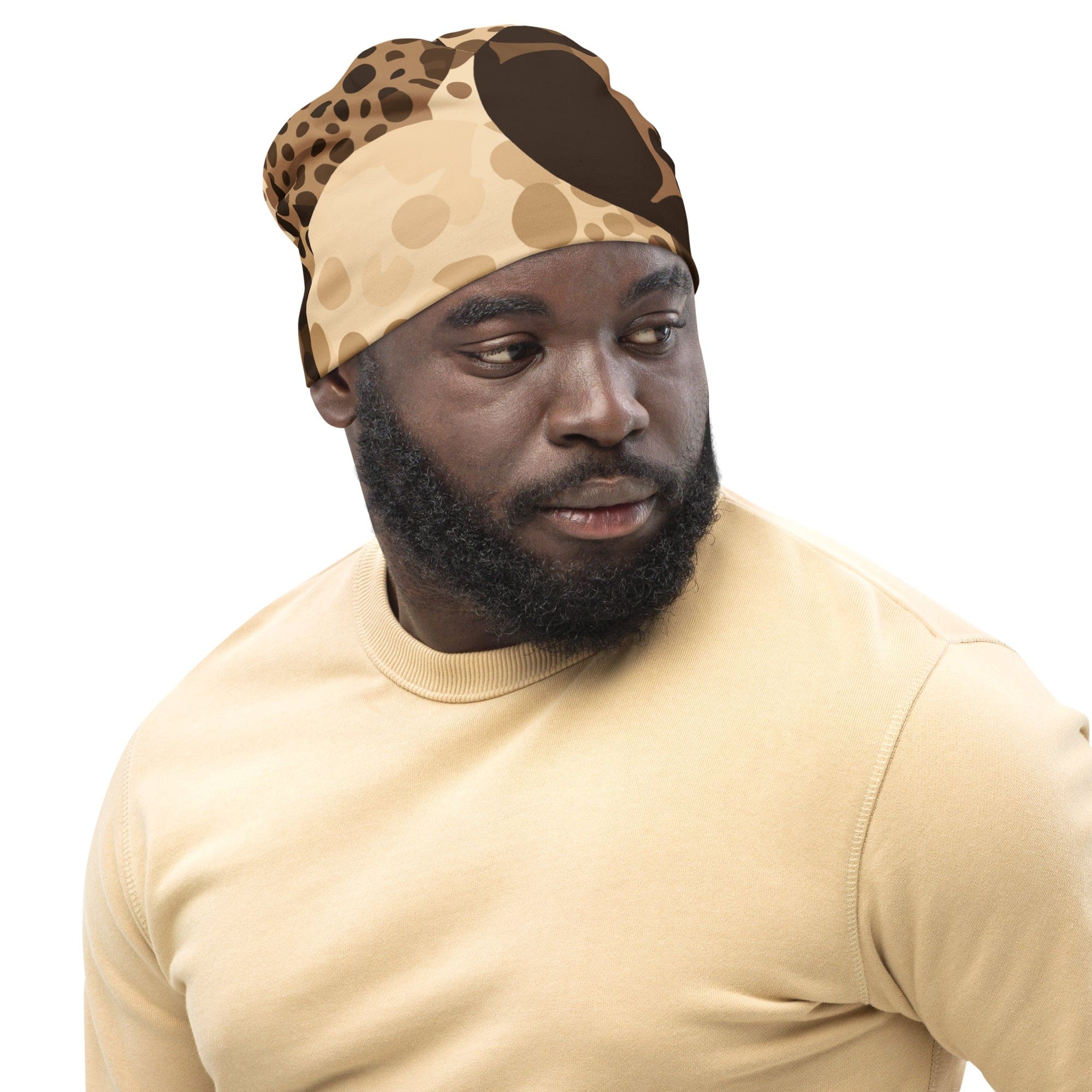 Double-layered beanie hat in beige and brown spotted print, showcasing its soft fabric and stylish design.