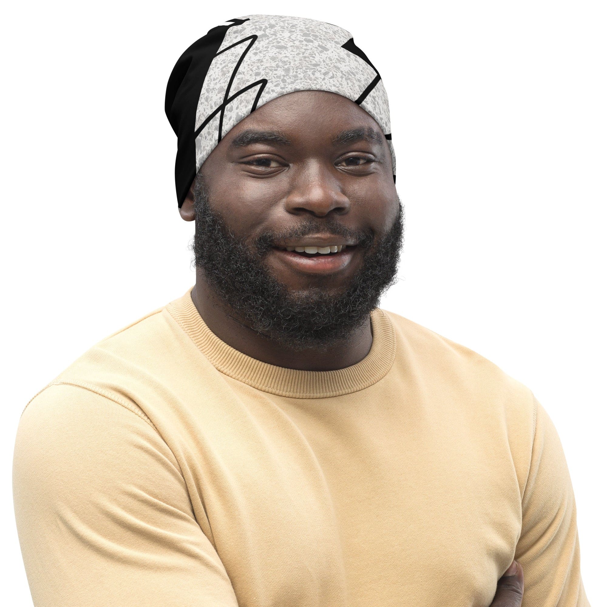 Double-layered beanie hat in black and white ash grey triangular colorblock design, showcasing its soft fabric and stylish appearance.