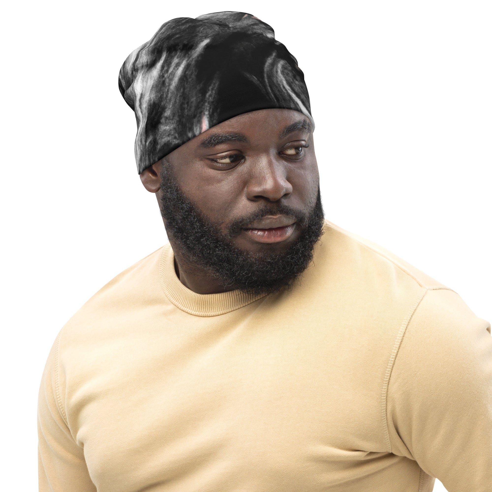 Double-layered beanie hat in black, pink, and white abstract pattern, showcasing its stylish design and soft fabric.