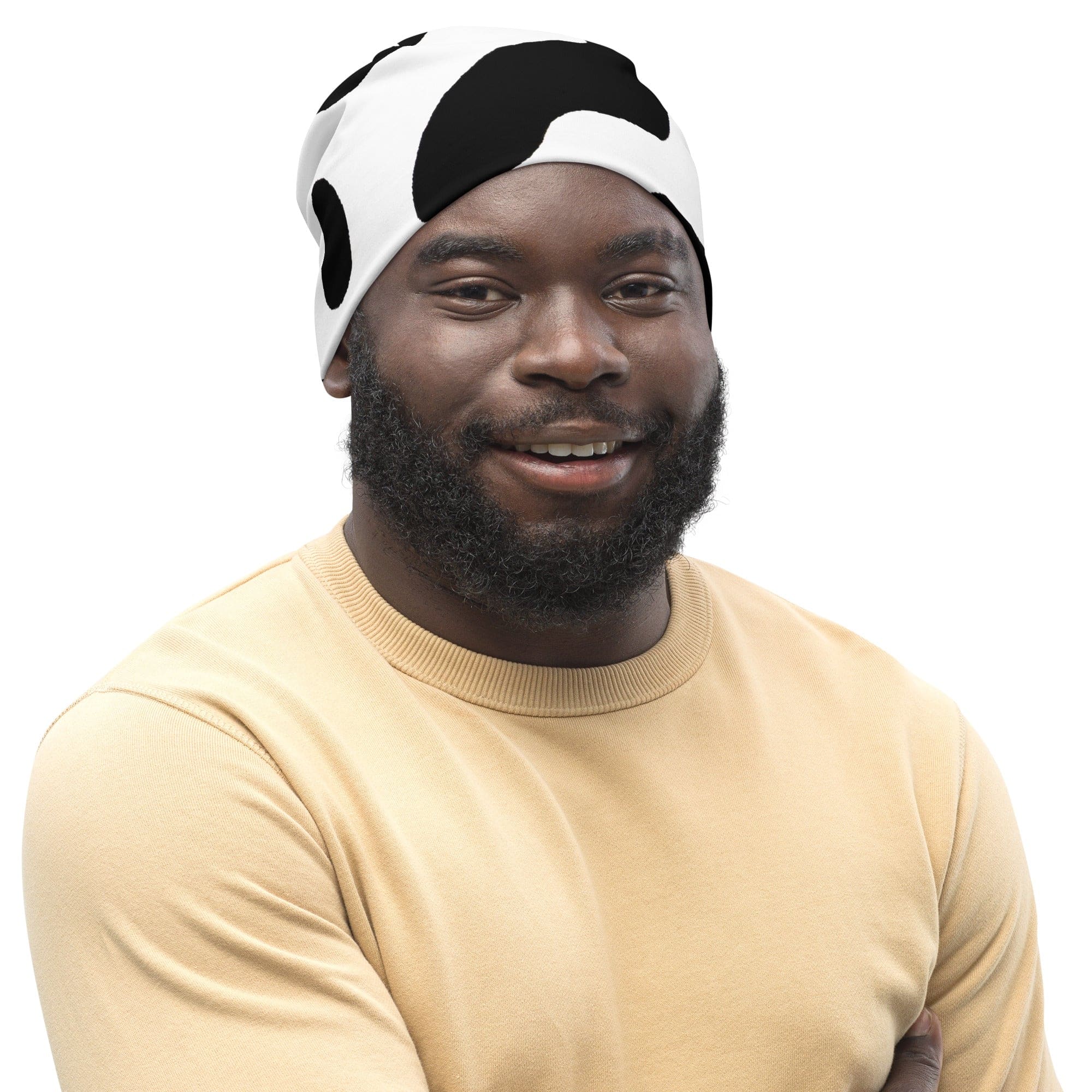 Double-layered beanie hat featuring a stylish black and white cow print design, perfect for winter and all seasons.