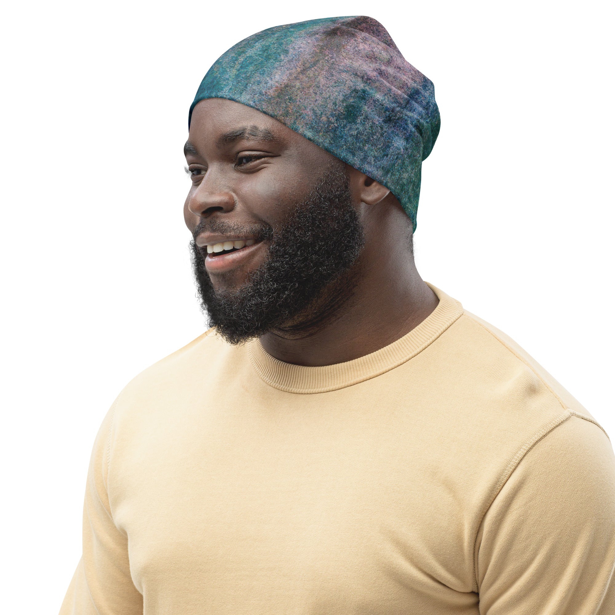 Double-layered beanie hat in blue hue watercolor abstract print, showcasing vibrant colors and a stylish design.