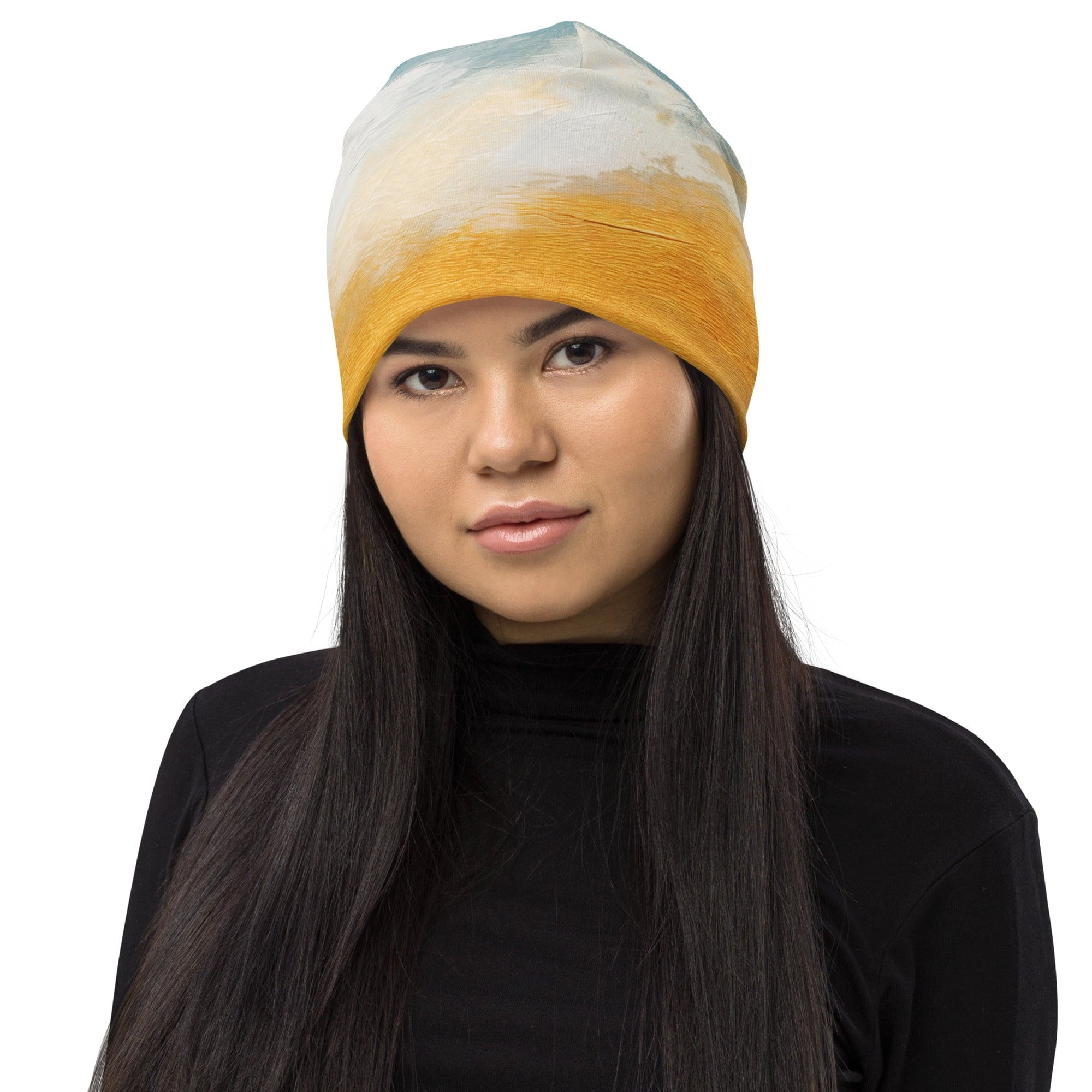 Double-layered beanie hat featuring a blue ocean and golden sunset print, perfect for stylish warmth in all seasons.