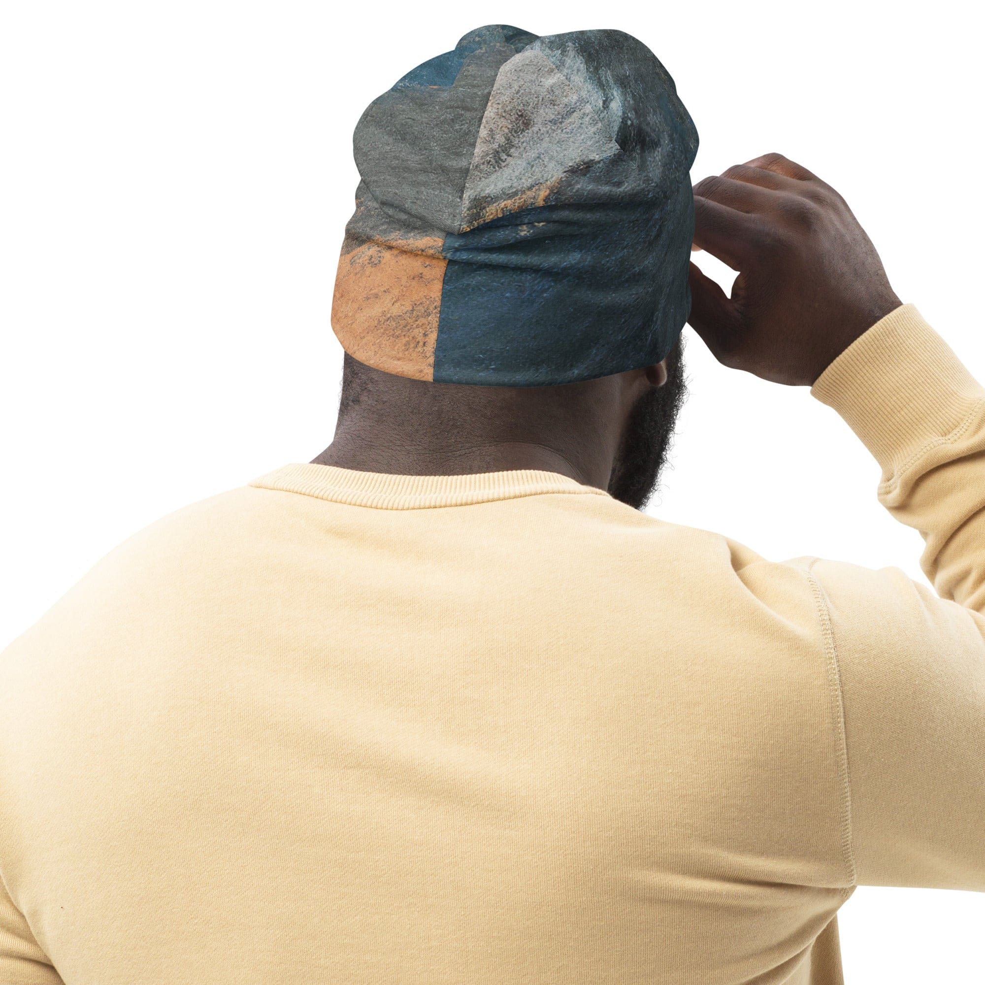 Double-layered beanie hat featuring a blue and orange abstract pattern, perfect for winter and stylish outfits.